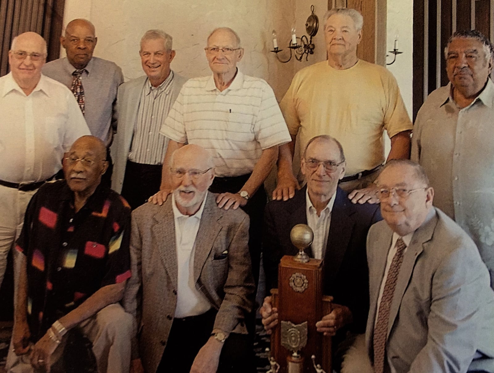 The 1950 Springfield High School State Basketball Champs pose for a photo in 2015 at the Marriott in Springfield. Bottom (left to right) Bob Hutchins; Lamar Kilgore; Bill Mckaig; and Dick Dillahunt. Top (left to right): Joe Cahoon; Boo Ellis; Dr. Bill Goettman; Earl Fritts; Don Dejong; and Bob Bronston.  Contributed