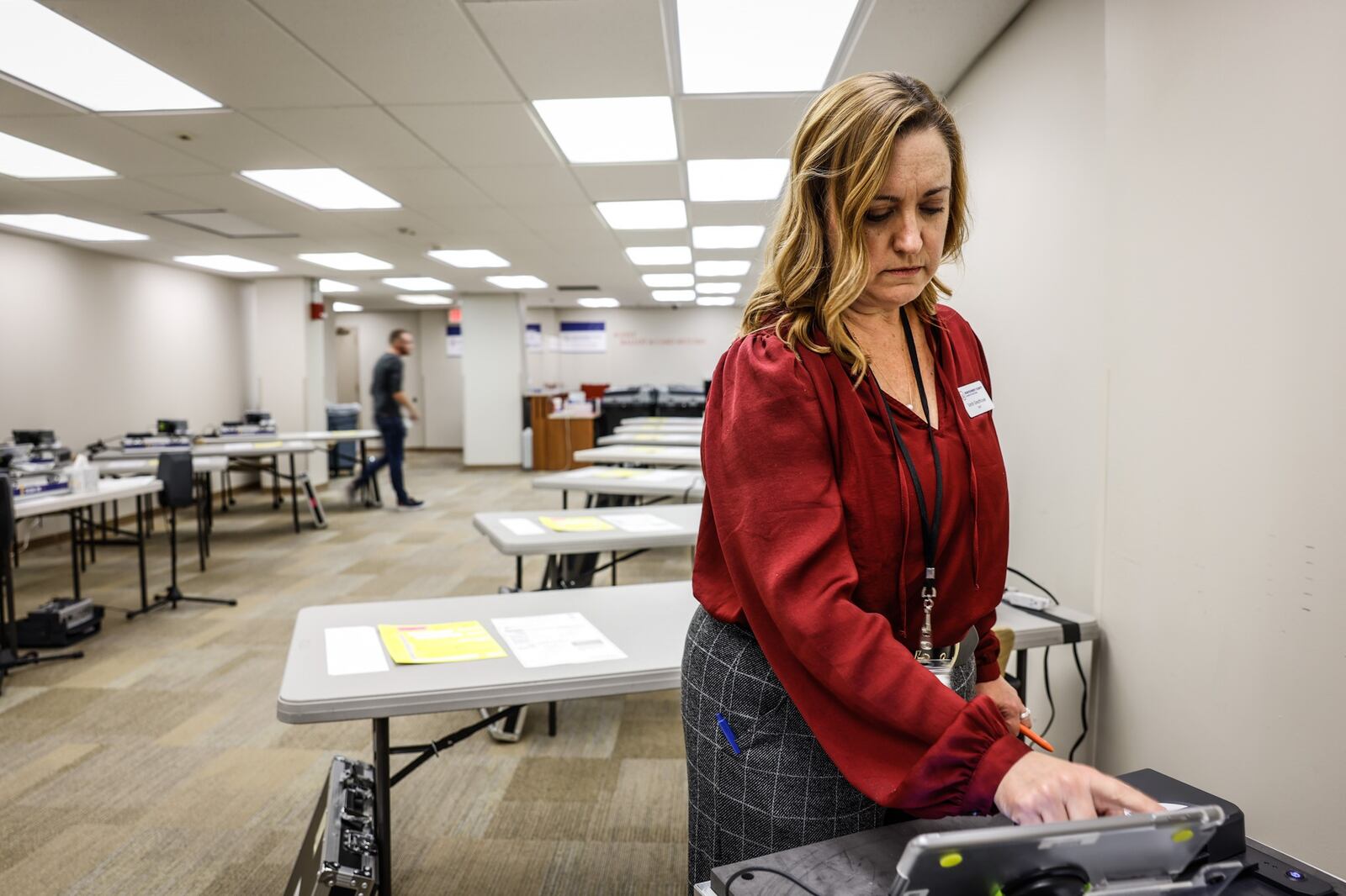 Deputy Director of the Montgomery County Board of Elections, Sarah W. Greathouse resets training equipment at the board of elections Tuesday October 4, 2022. Montgomery County Board of Elections held a press conference to discuss the upcoming Nov. 8, general election. JIM NOELKER/STAFF