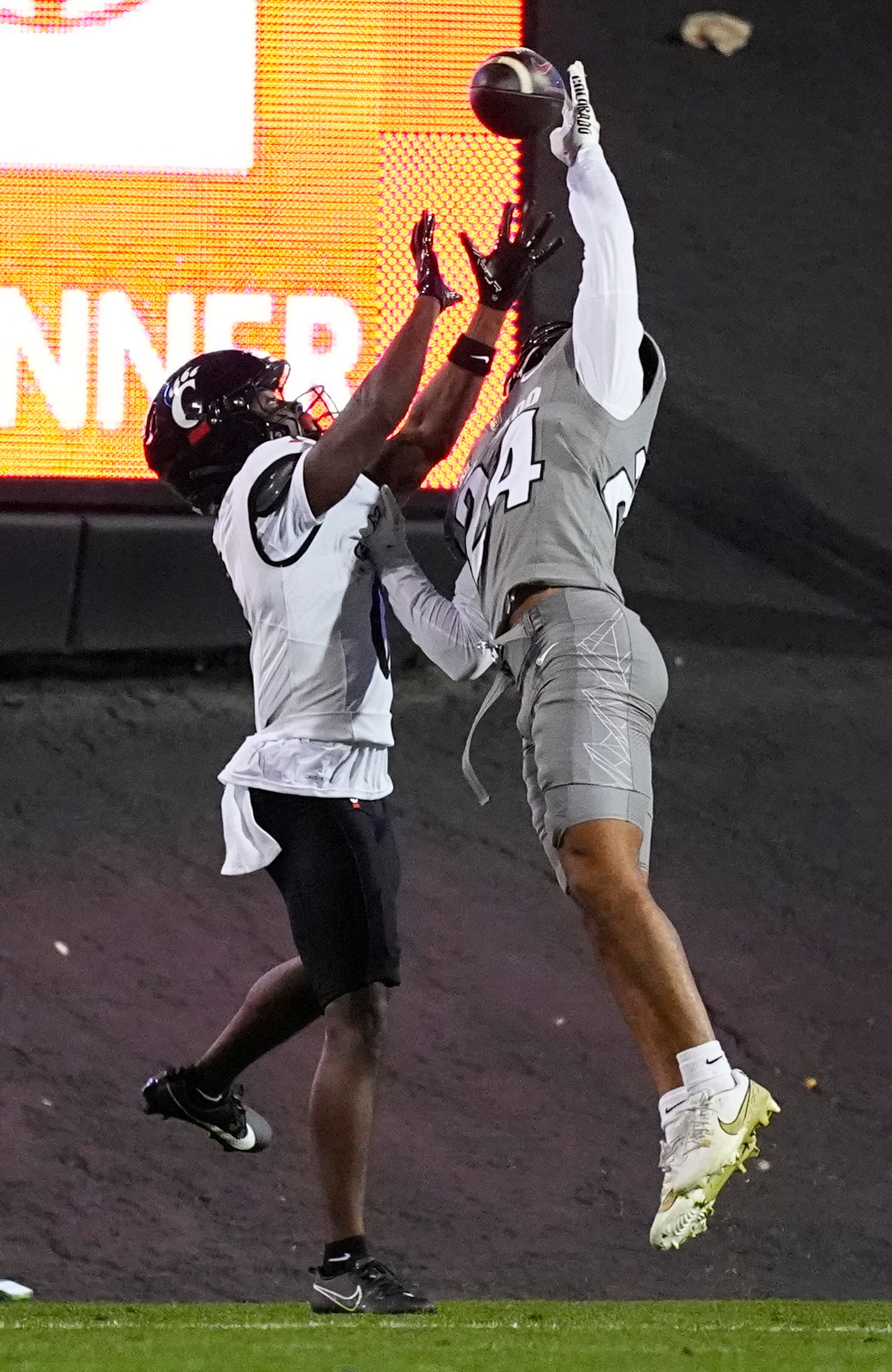 Colorado cornerback Preston Hodge, right, breaks up a pass for Cincinnati wide receiver Tony Johnson in the second half of an NCAA college football game Saturday, Oct. 26, 2024, in Boulder, Colo. (AP Photo/David Zalubowski)