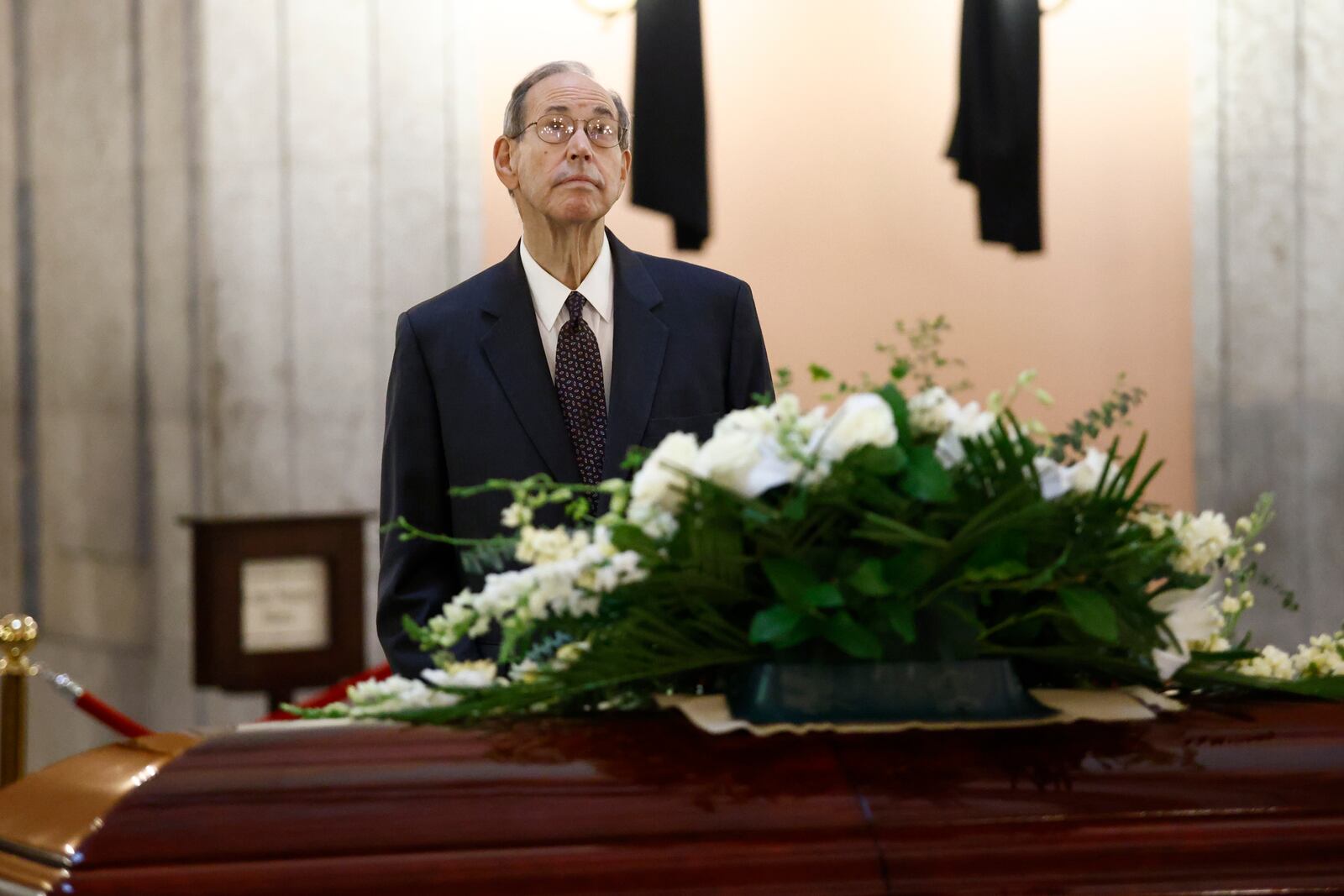 Former Ohio governor Bob Taft pauses at the casket for former Ohio House speaker Jo Ann Davidson as it lie in state in the rotunda of the Ohio Sate House in Columbus, Ohio, Thursday, Oct. 31, 2024. (AP Photo/Paul Vernon)