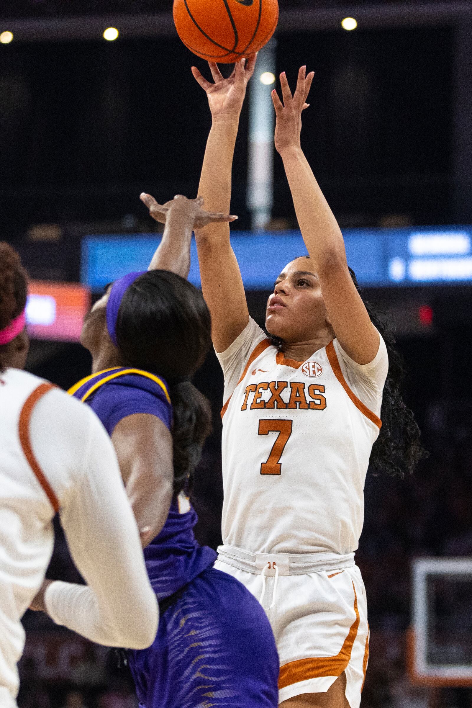 Texas guard Jordan Lee (7) shoots over LSU guard Aneesah Morrow during the second half of an NCAA college basketball game in Austin, Texas, Sunday, Feb. 16, 2025. (AP Photo/Stephen Spillman)