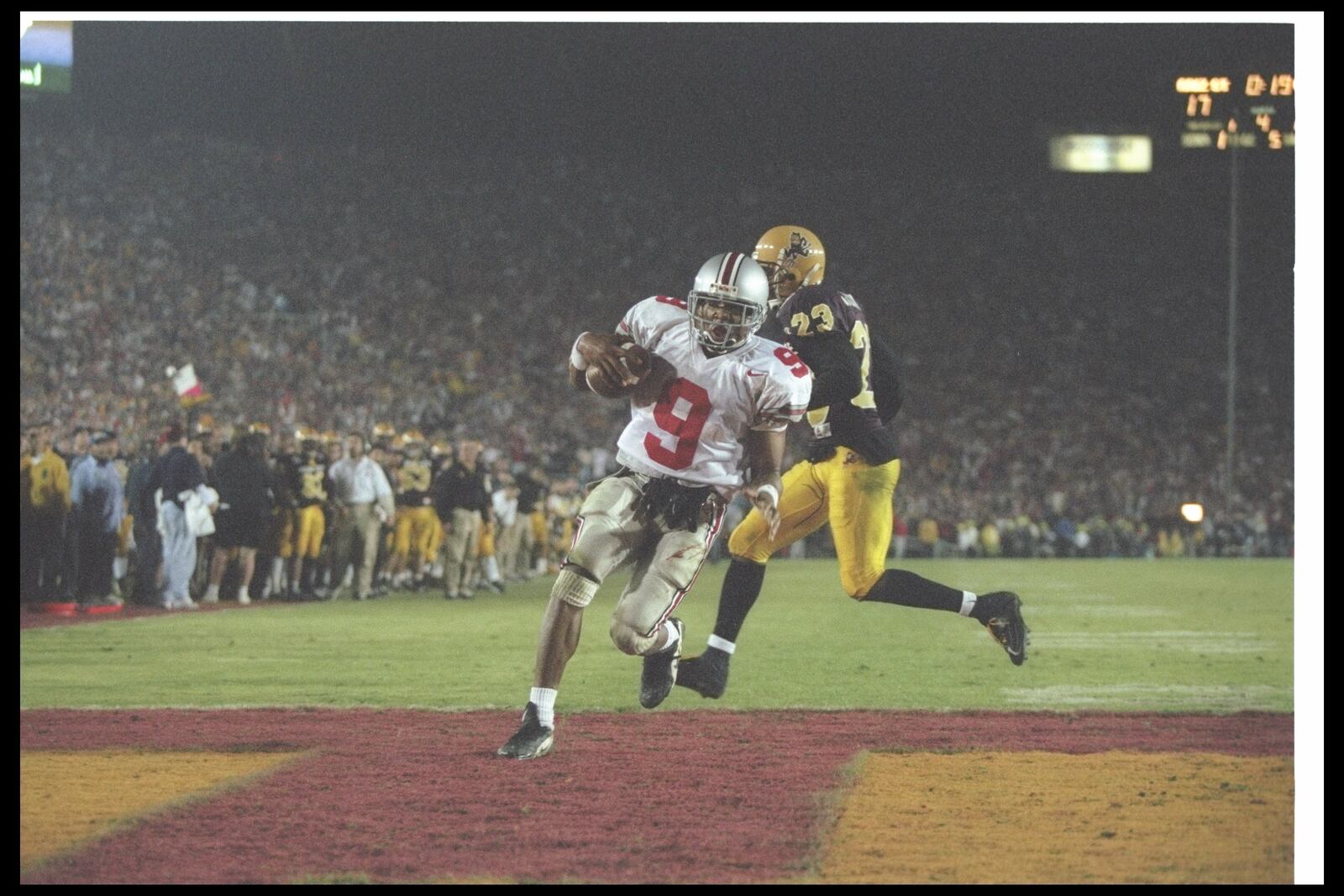 1 Jan 1997:  David Boston of the Ohio State Buckeyes moves the ball as Arizona State Sun Devils defensive back Courtney Jackson chases him during the Rose Bowl at the Rose Bowl in Pasadena, California.  Ohio State won the game, 20-17. Mandatory Credit: Je