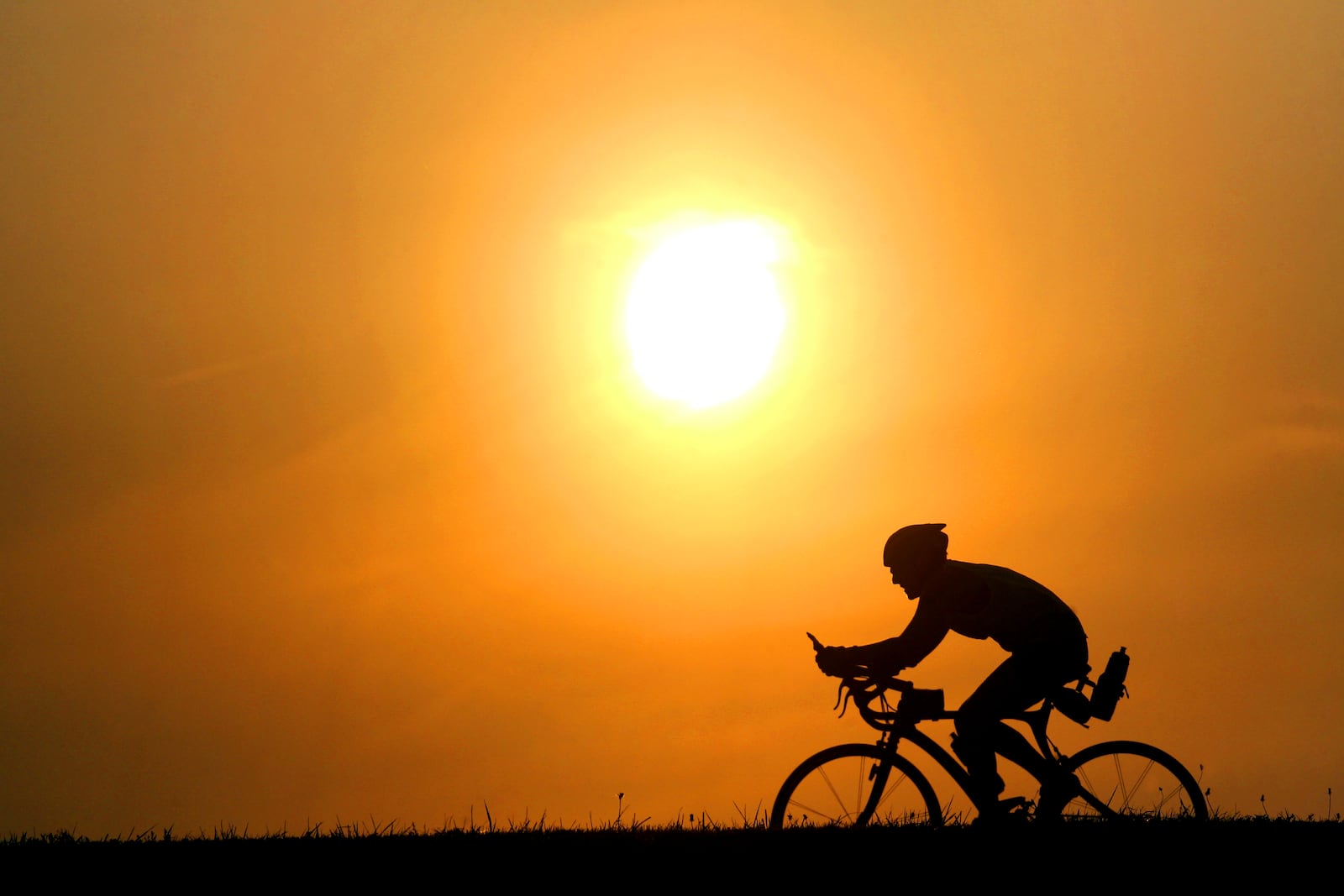 A biker travels along the Great Miami River bike path. Staff file photo by Nick Daggy