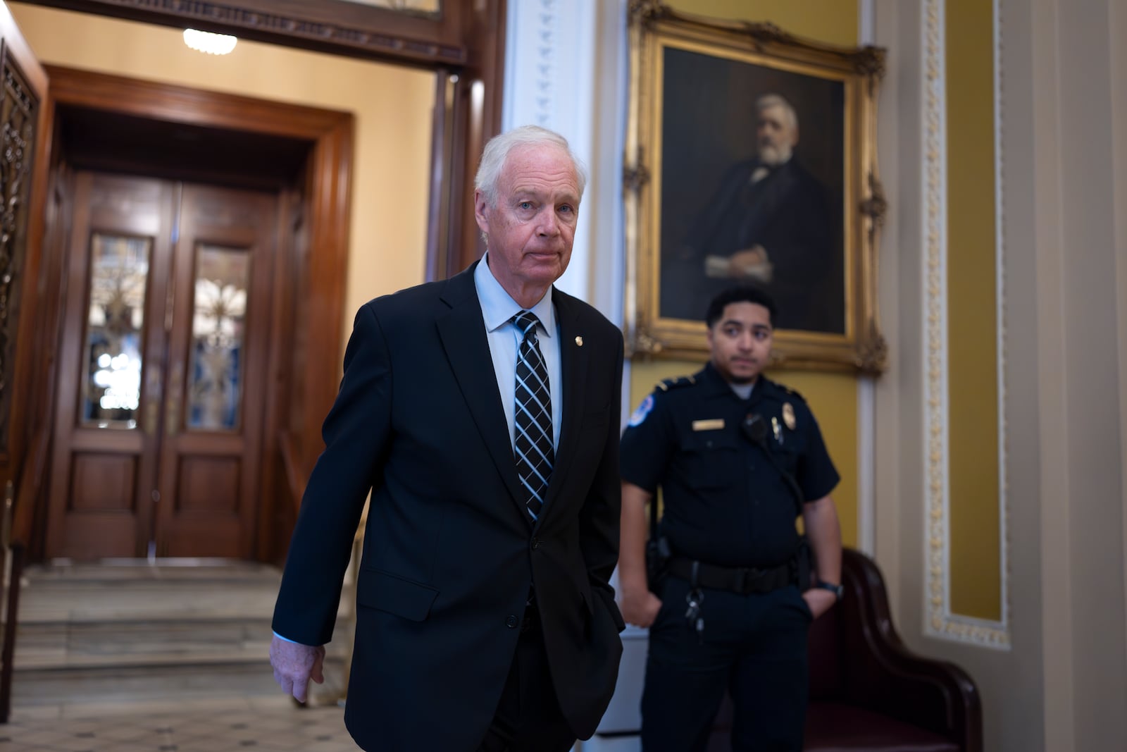 Sen. Ron Johnson, R-Wis., a member of the Senate Committee on Homeland Security and Governmental Affairs, leaves the chamber during debate on the confirmation of Kash Patel, Trump's pick to be FBI director, at the Capitol in Washington, Thursday, Feb. 20, 2025. (AP Photo/J. Scott Applewhite)