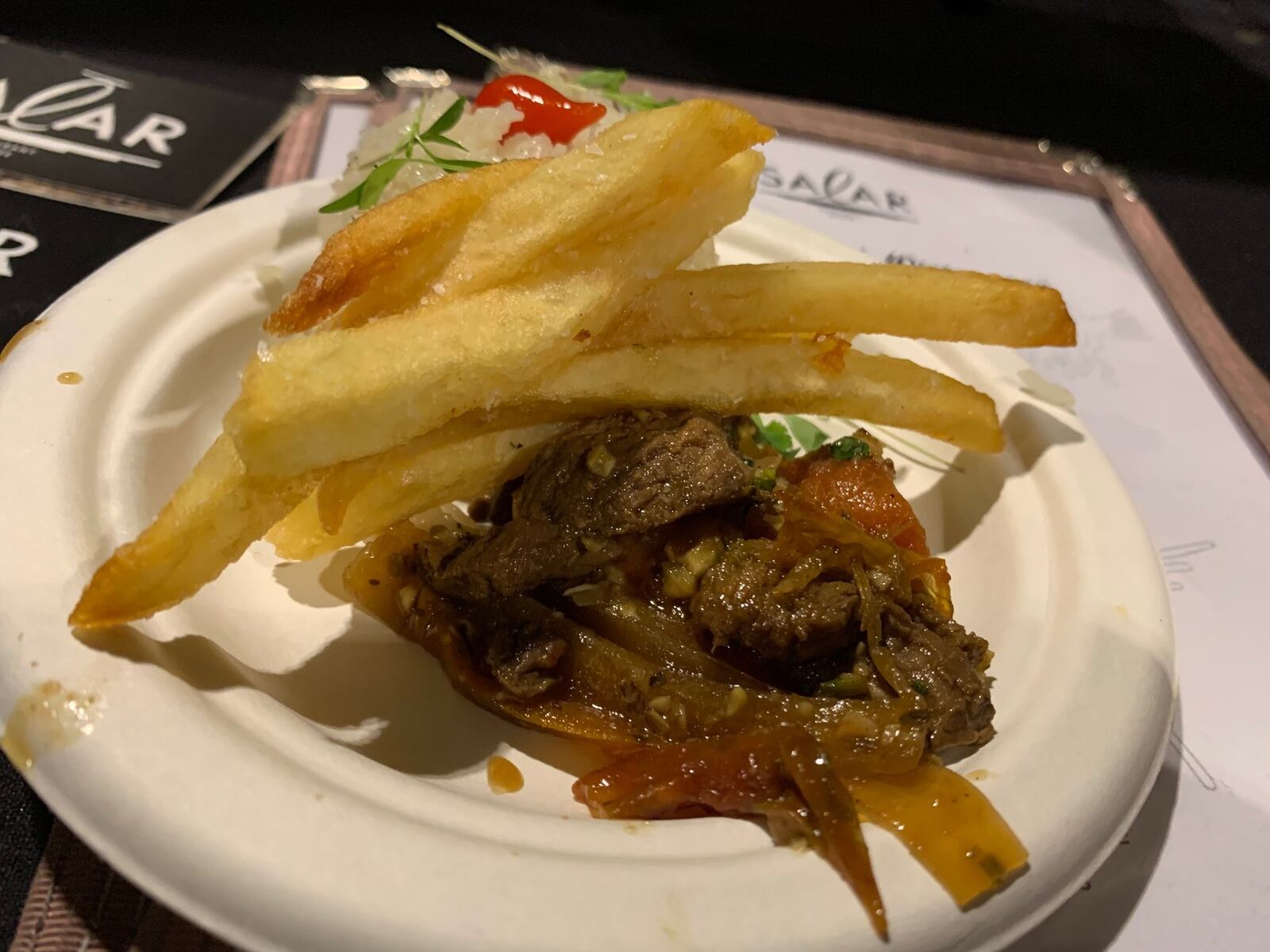 Salar served pan seared strips of filet mignon with sautéed onions, tomatoes, yellow Peruvian peppers and spices tossed with French fries over Jasmine rice at the Miami Valley Restaurant Association’s Sneak Peek to Winter Restaurant Week. CONTRIBUTED/ALEXIS LARSEN