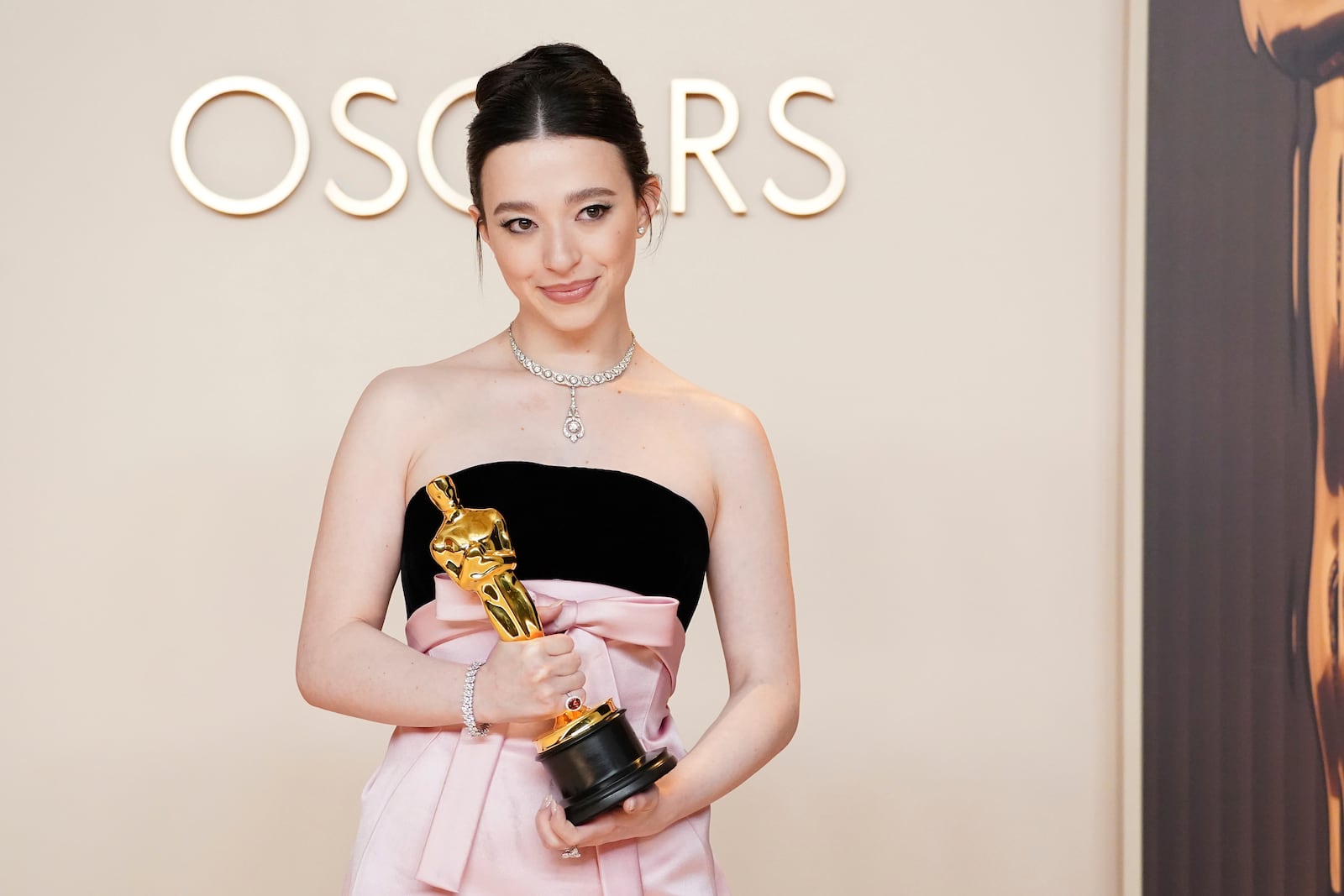 Mikey Madison, winner of the award for best performance by an actress in a leading role for "Anora," poses in the press room at the Oscars on Sunday, March 2, 2025, at the Dolby Theatre in Los Angeles. (Photo by Jordan Strauss/Invision/AP)