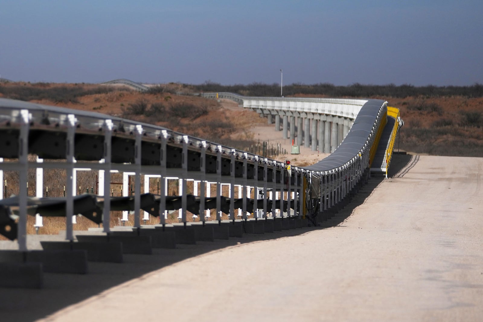 A 42-mile conveyor belt by Atlas Energy carries sand needed for hydraulic fracturing Wednesday, Feb. 26, 2025, in Kermit, Texas. (AP Photo/Julio Cortez)