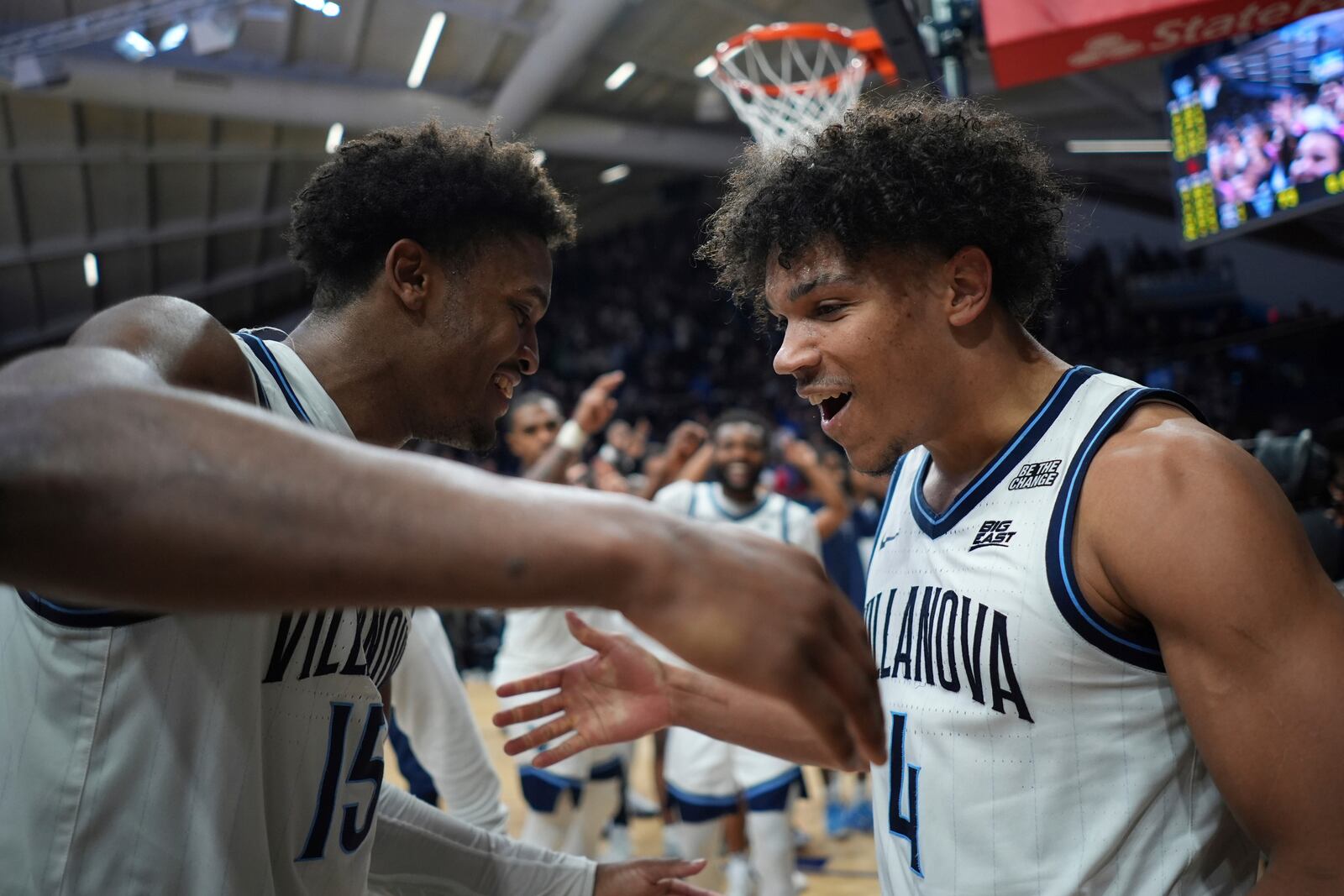 Villanova's Jordan Longino, left, and Tyler Perkins celebrate after Villanova won an NCAA college basketball game against St. John's, Wednesday, Feb. 12, 2025, in Villanova, Pa. (AP Photo/Matt Slocum)