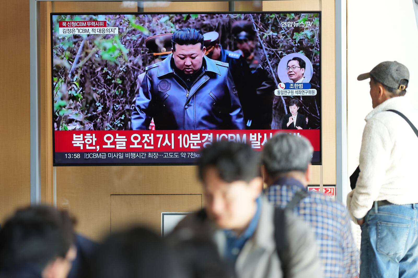 A TV screen shows an image of North Korean leader Kim Jong Un during a news program at the Seoul Railway Station in Seoul, South Korea, Thursday, Oct. 31, 2024. The letters read "North Korea, launched a new intercontinental ballistic missile today." (AP Photo/Lee Jin-man)