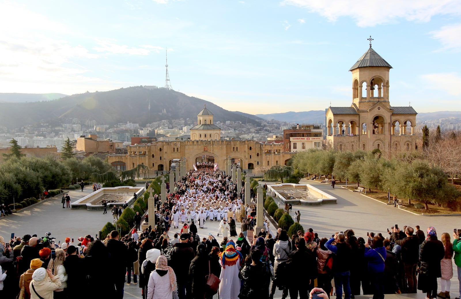 FILE - Georgians and their children take a part in a religious procession to mark Orthodox Christmas in Tbilisi, Georgia, on Jan. 7, 2024. (AP Photo/Shakh Aivazov, File)