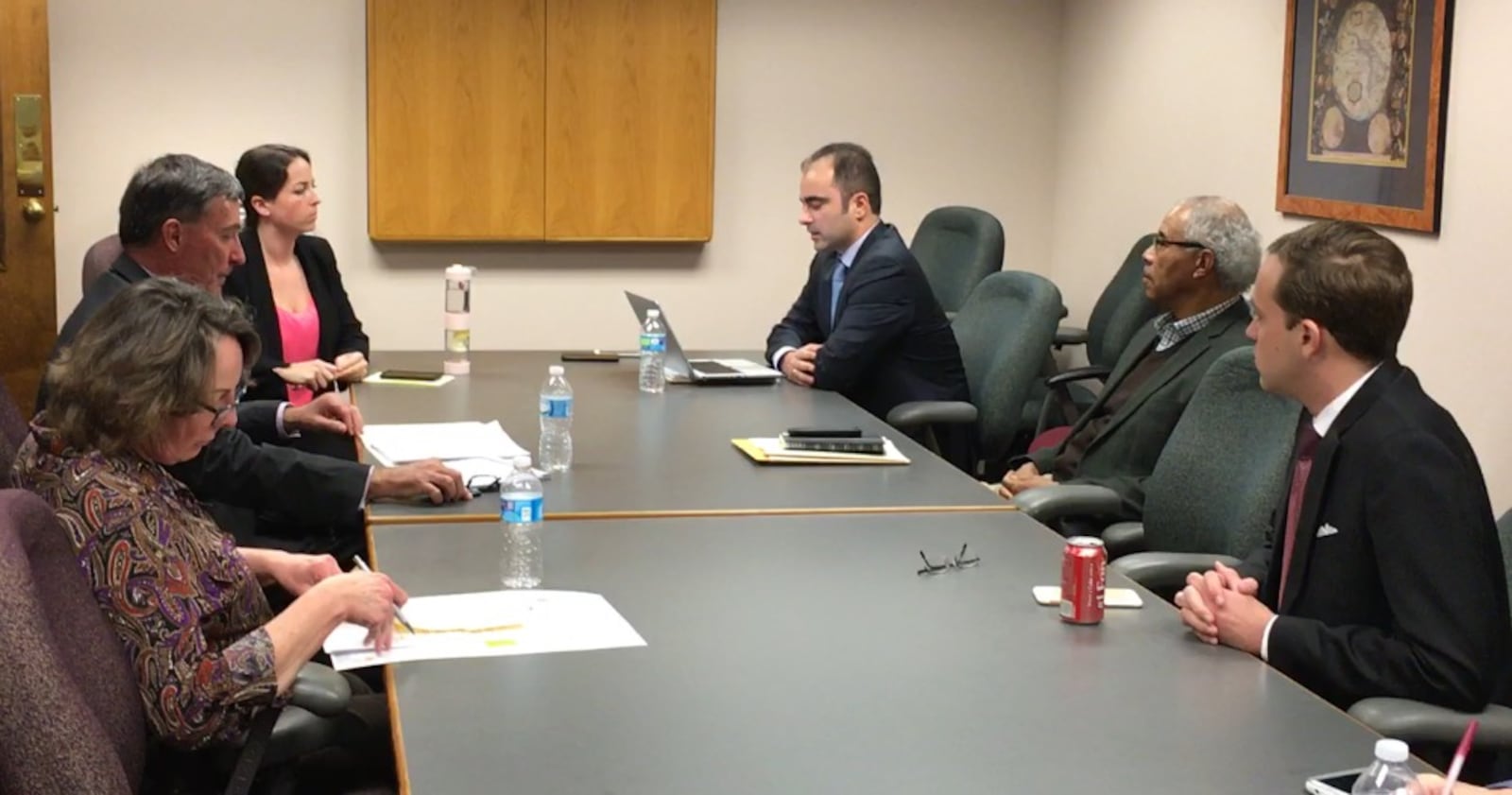 Dayton school board President Adil Baguirov (center) presides over a Feb. 23, 2016 special meeting where the school board voted to non-renew the contract of district treasurer Craig Jones. JEREMY P. KELLEY / STAFF