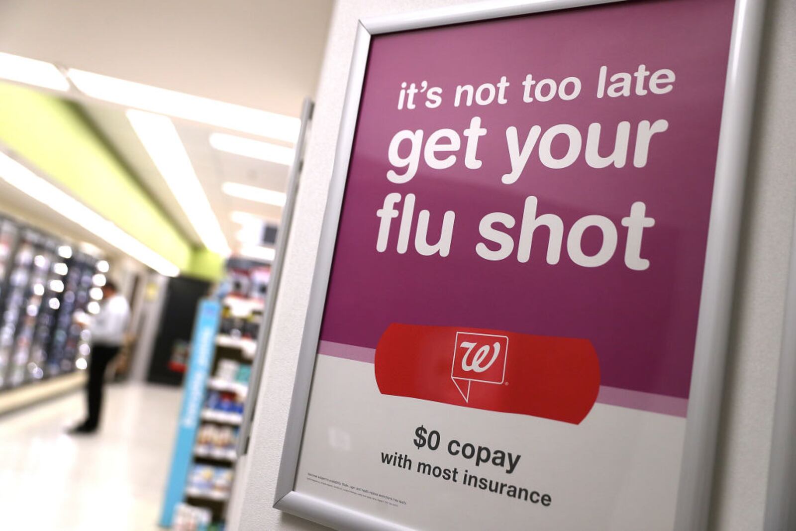 SAN FRANCISCO, CA - JANUARY 22:  A sign advertising flu shots is displayed at a Walgreens phramacy on January 22, 2018 in San Francisco, California. A strong strain of H3N2 influenza has claimed the lives of 74 Californians under the age of 65 since the flu season began in October of last year. People are being encouraged to get flu shots even through the vaccine has been only 30% effective in combating the influenza.  (Photo by Justin Sullivan/Getty Images)