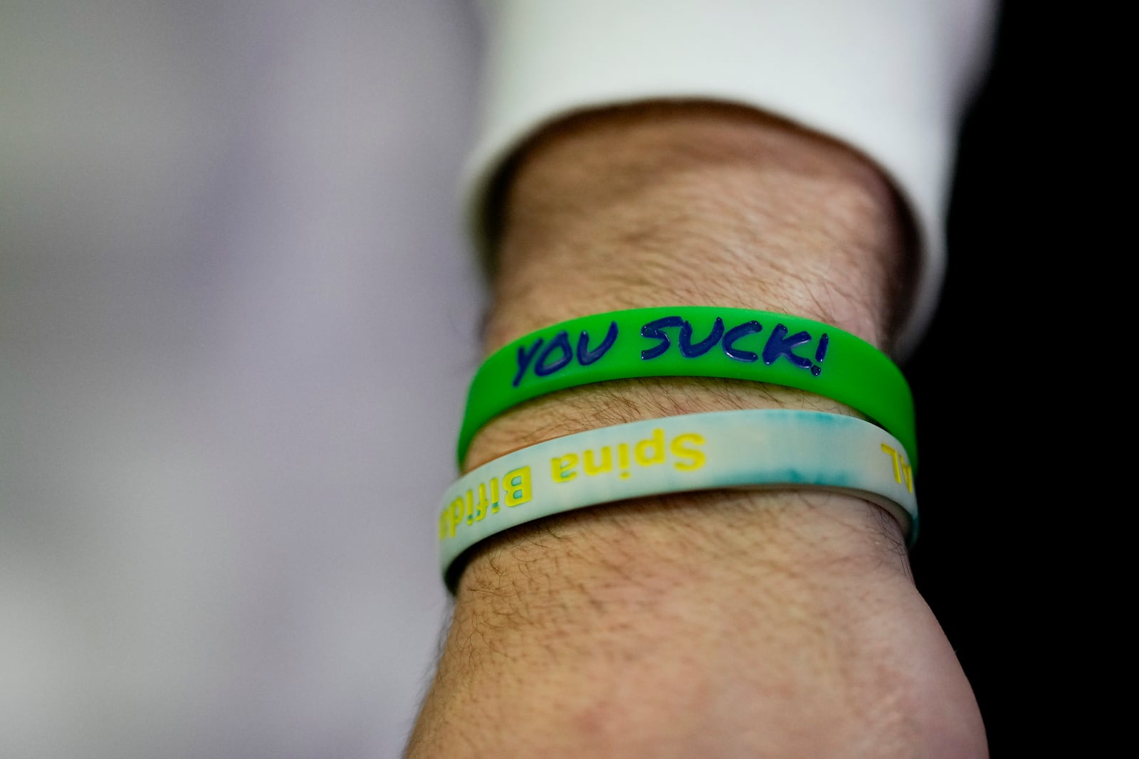 Notre Dame quarterback Riley Leonard shows a wristband that reminds him to stay humble during media day ahead of the national championship NCAA College Football Playoff game between Ohio State and Notre Dame Saturday, Jan. 18, 2025, in Atlanta. The game will be played on Monday.(AP Photo/Chris Carlson)