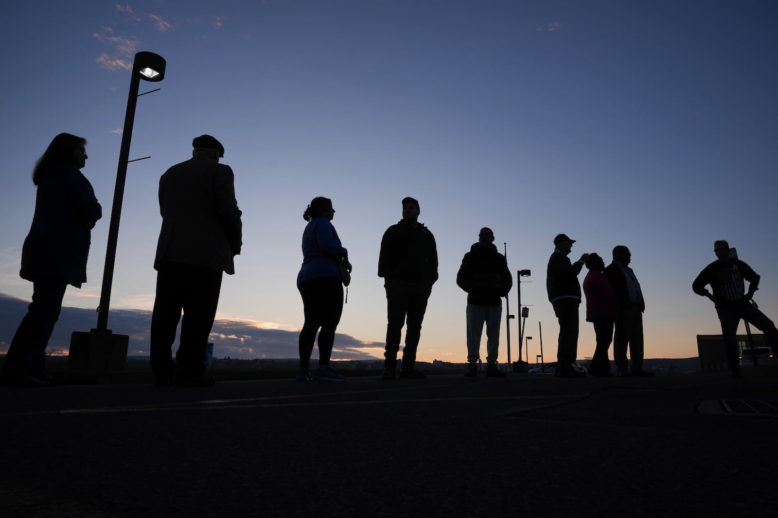 FILE - Voters wait in line to cast their ballots at Scranton High School in Scranton, Pa., on Election Day, Tuesday, Nov. 5, 2024. (AP Photo/Matt Rourke, File)