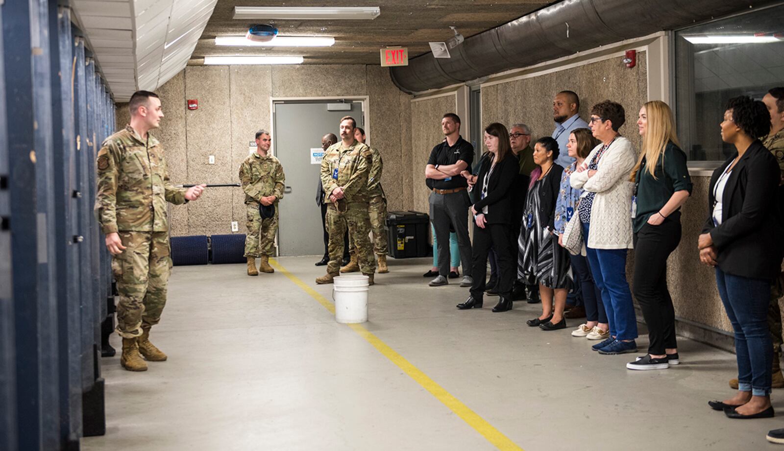 Tech. Sgt. Sawyer McIntyre (left), 88th Security Forces Squadron, leads a tour of the shooting range for LEADership Wright-Patt students May 3 at Wright-Patterson Air Force Base. Students got a look at SFS facilities and watched a military working dog demonstration. U.S. AIR FORCE PHOTO/JAIMA FOGG