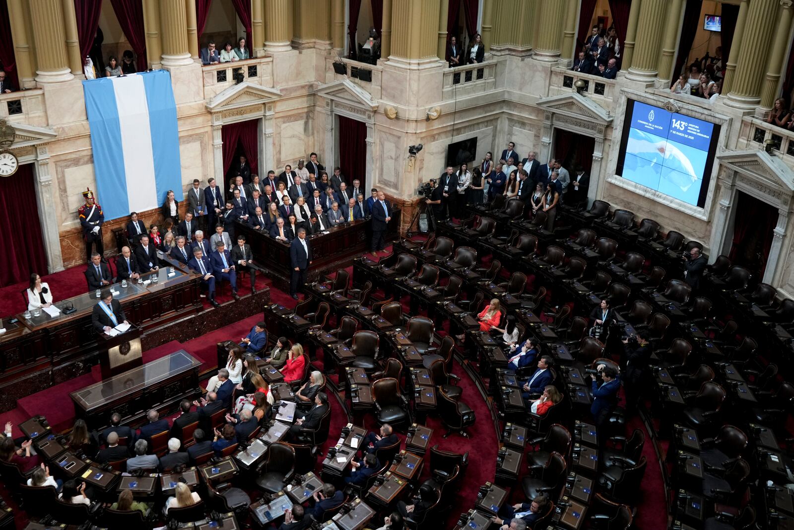 Argentina's President Javier Milei, left, delivers the annual State of the Nation address, which marks the start of the legislative year, in Buenos Aires, Argentina, Saturday, March 1, 2025. (AP Photo/Rodrigo Abd)