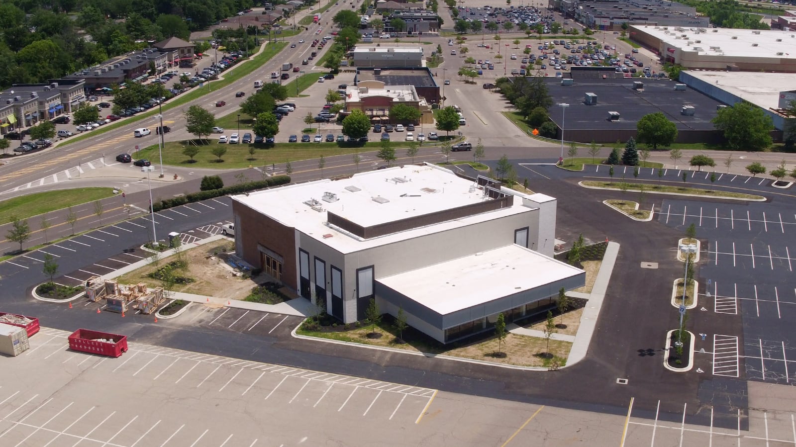 Construction of a new Outback Steakhouse at the Dayton Mall has transformed the former Sears Automotive Center in to a modern looking building that will also include retail space.   TY GREENLEES / STAFF