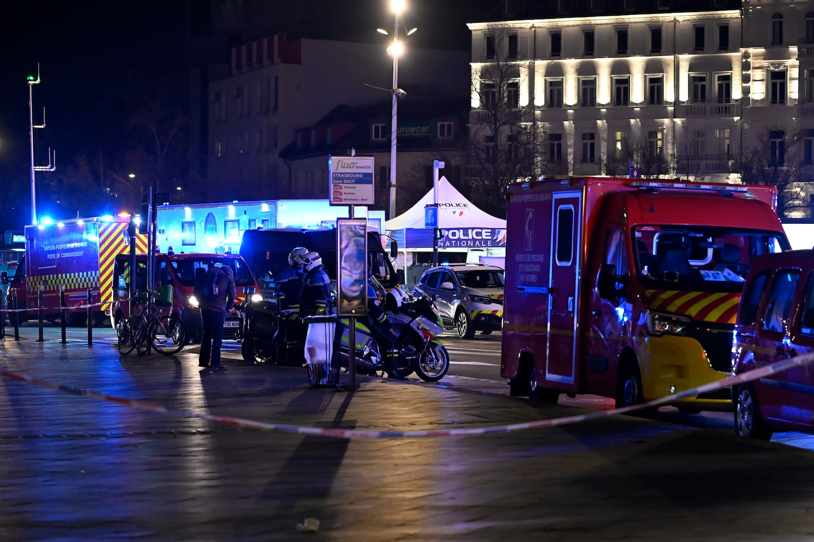 Police officers block the access to the station after two trams collided, injuring dozens of people, though none critically, firefighters said, Saturday, Jan. 11, 2025 in Strasbourg, eastern France. (AP Photo/Pascal Bastien)