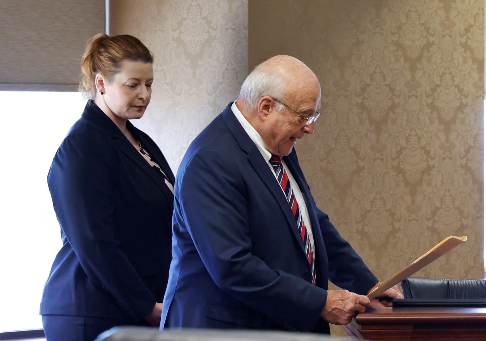 Butler County Prosecutor Michael Gmoser reads a statement after a plea agreement on Friday, June 7, 2024, in which  John Carter admitted to his role in the death of Katelyn Markham. The 21-year-old art student died nearly 13 years but was not found until nearly two years later. Carter was indicted about 15 months ago. Assistant Prosecutor Katie Pridemore is on the left. NICK GRAHAM/STAFF