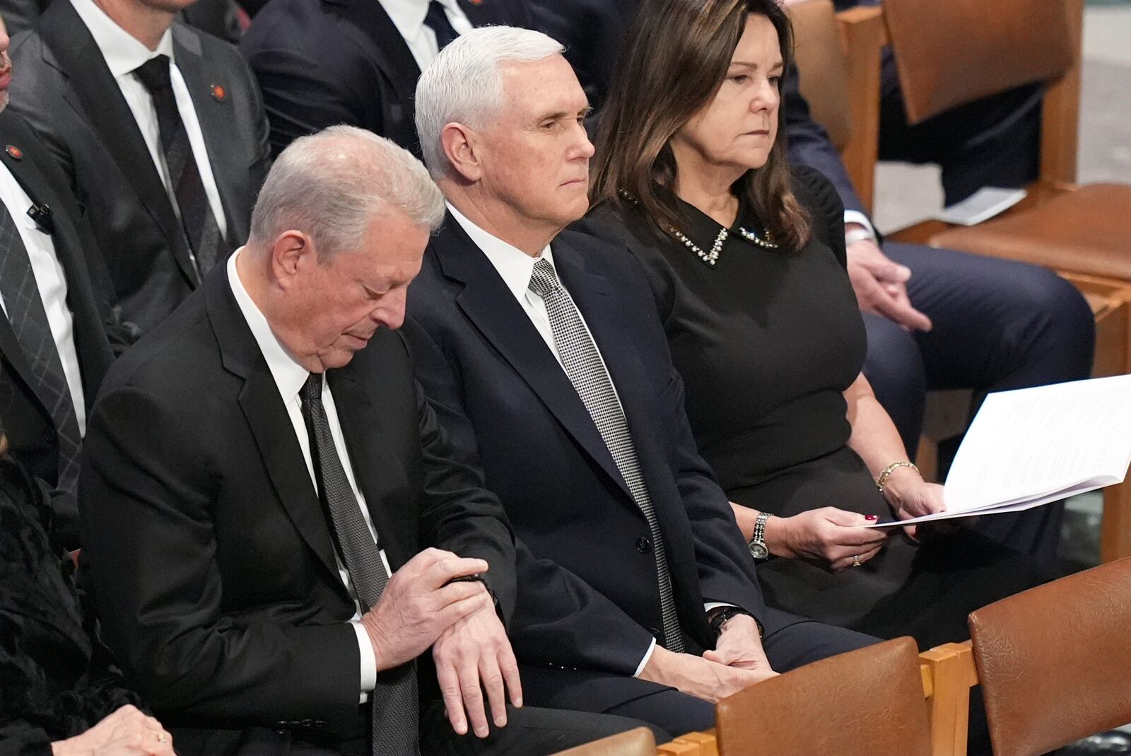 Former Vice President Al gore sits with former Vice President Mike Pence and his wife Karen before the state funeral for former President Jimmy Carter at Washington National Cathedral in Washington, Thursday, Jan. 9, 2025. (AP Photo/Jacquelyn Martin)