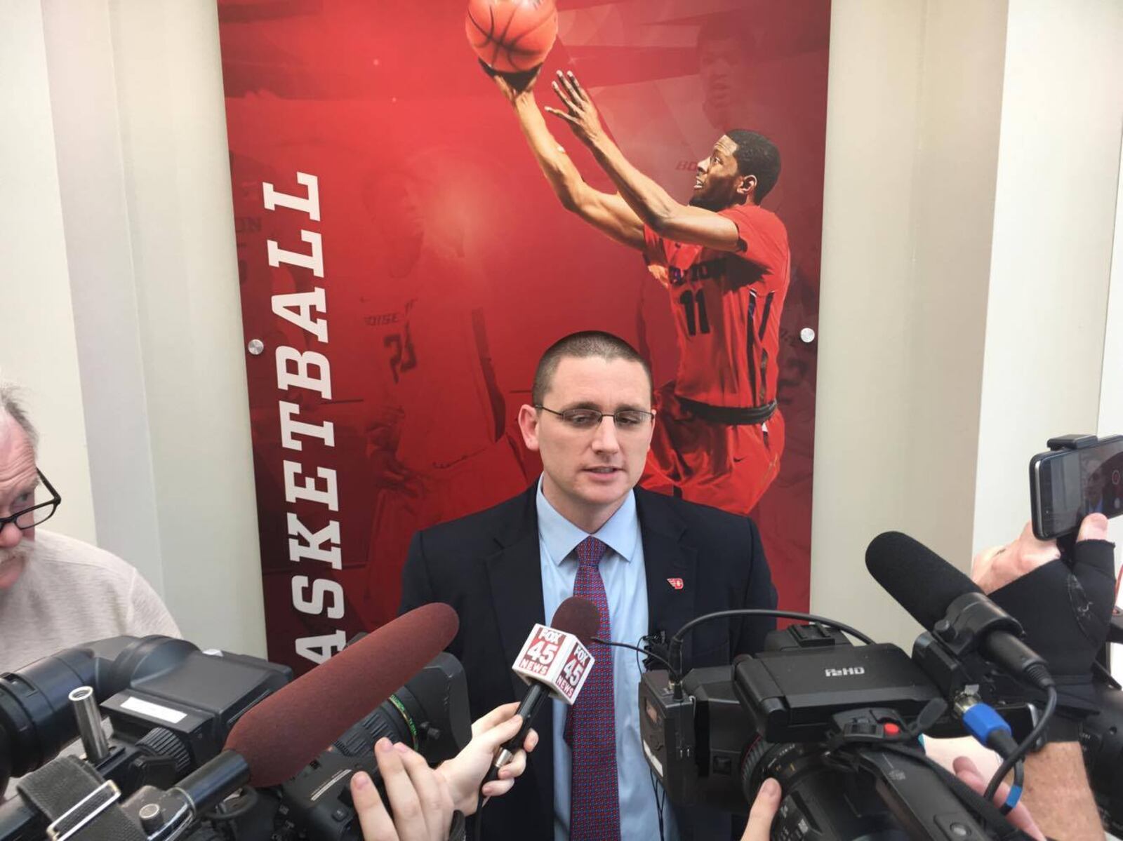 Dayton’s Neil Sullivan talks to reporters on Saturday, March 25, 2017, at UD’s Frericks Center. David Jablonski/Staff