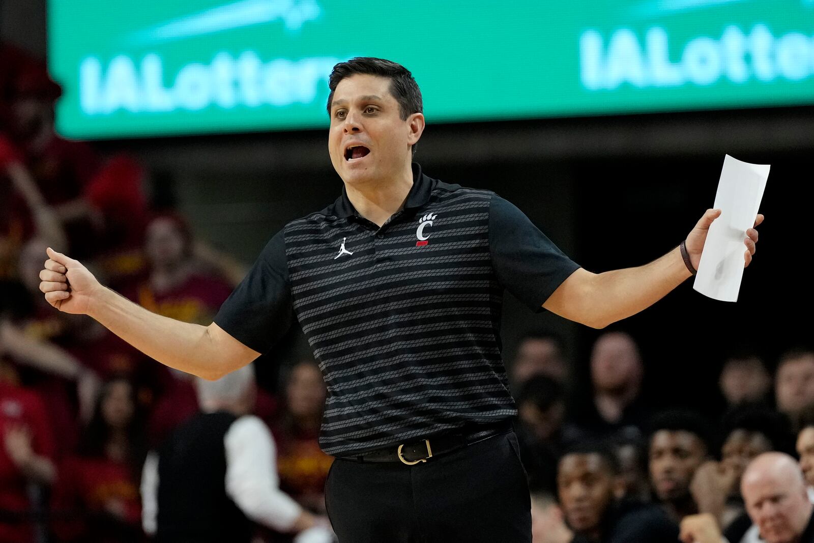 Cincinnati head coach Wes Miller directs his team during the first half of an NCAA college basketball game against Iowa State Saturday, Feb. 15, 2025, in Ames, Iowa. (AP Photo/Charlie Neibergall)