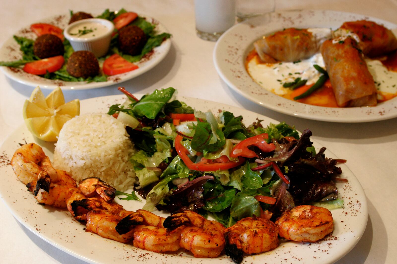 Three Turkish specialties offered at the Pasha Grill, a restaurant at the Greene, are (clockwise from front) the Grilled Shrimp, the Falafel appetiser and Lahana Sarma. FILE