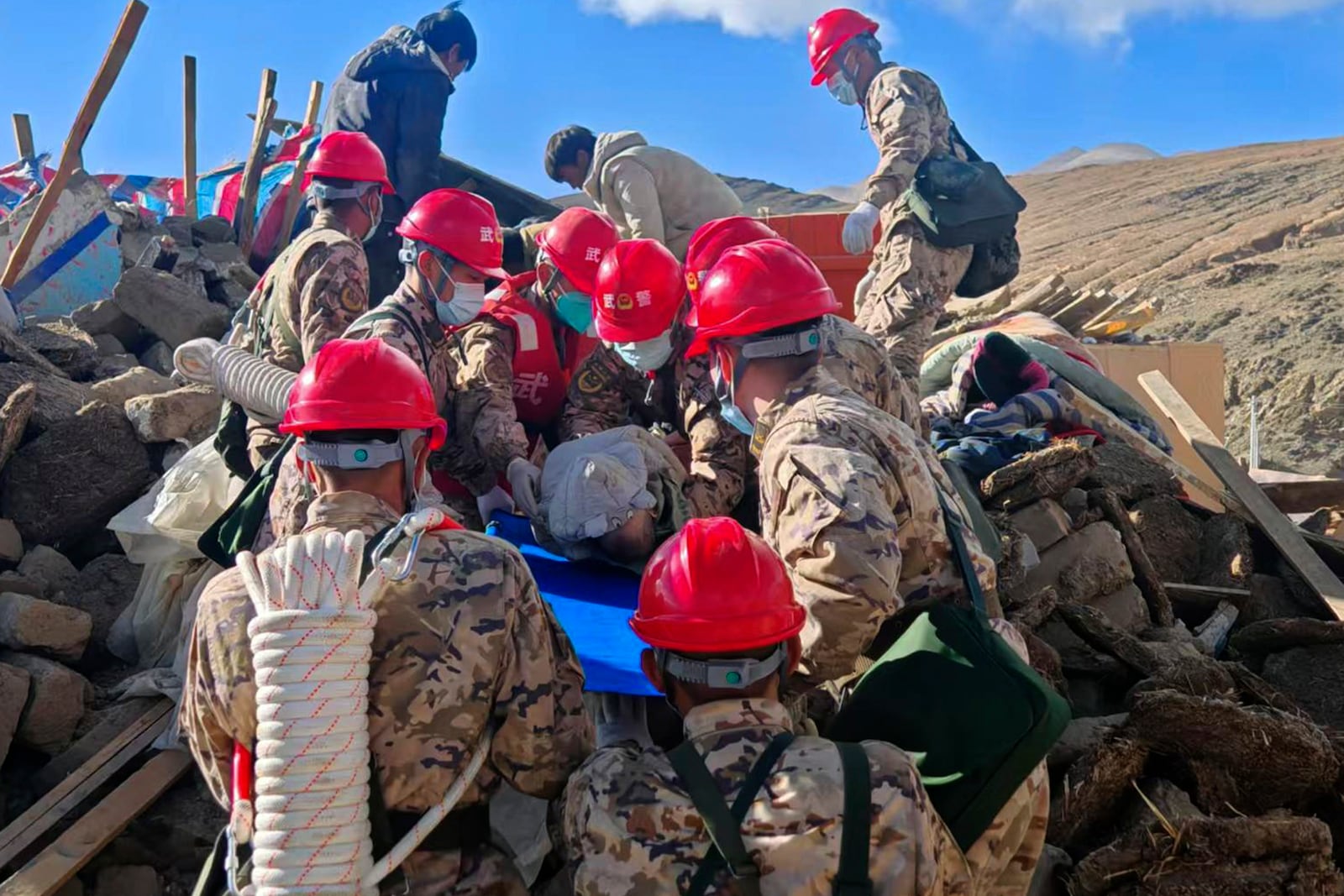 In this photo released by Xinhua News Agency, first responders perform rescue work at a village in Changsuo Township of Dingri County in Xigaze, southwest China's Tibet Autonomous Region, Jan. 7, 2025 (Hu Zikui/Xinhua via AP)