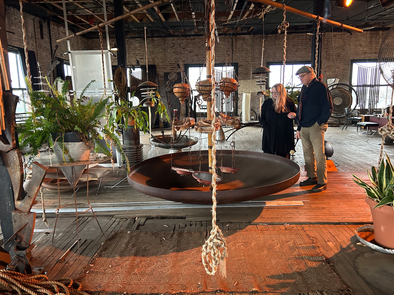 Sandy and Michael Bashaw with a "Sound Sculpture". The couple have performed as experimental group Theater of Sound and world music ensemble Puzzle of Light.