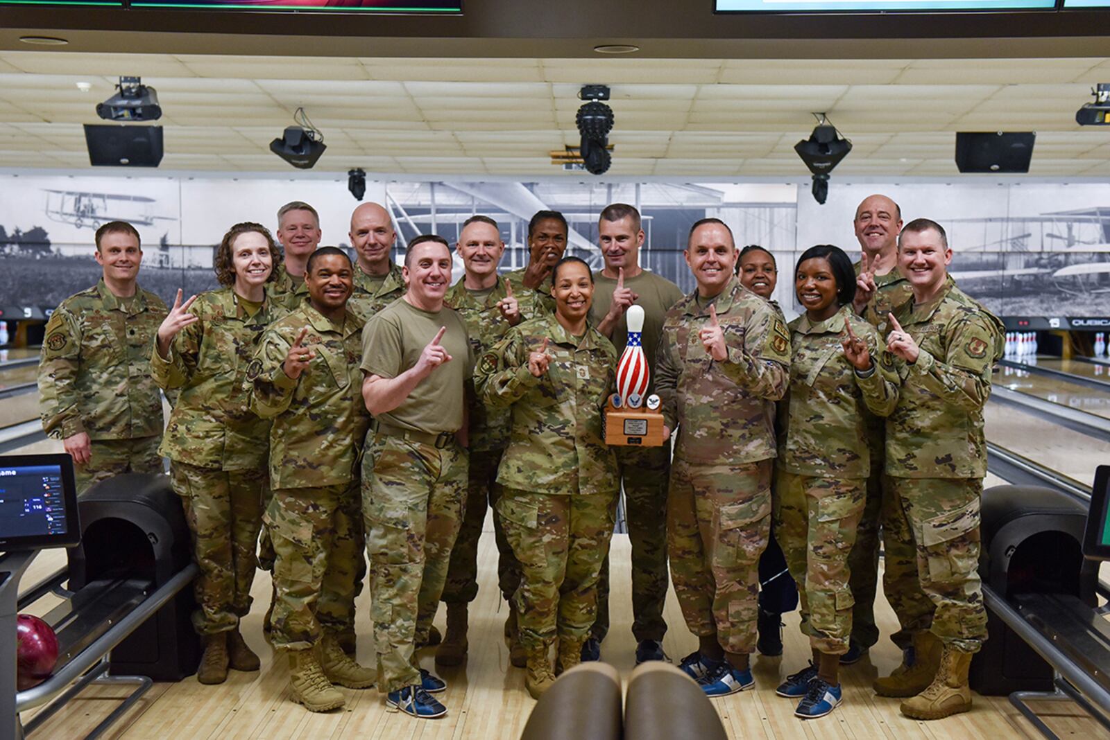 Participants in the Eagles vs. Chiefs Bowling Challenge pose with the trophy April 11 at Kittyhawk Lanes on Wright-Patterson Air Force Base. U.S. AIR FORCE PHOTO/SENIOR AIRMAN JACK GARDNER