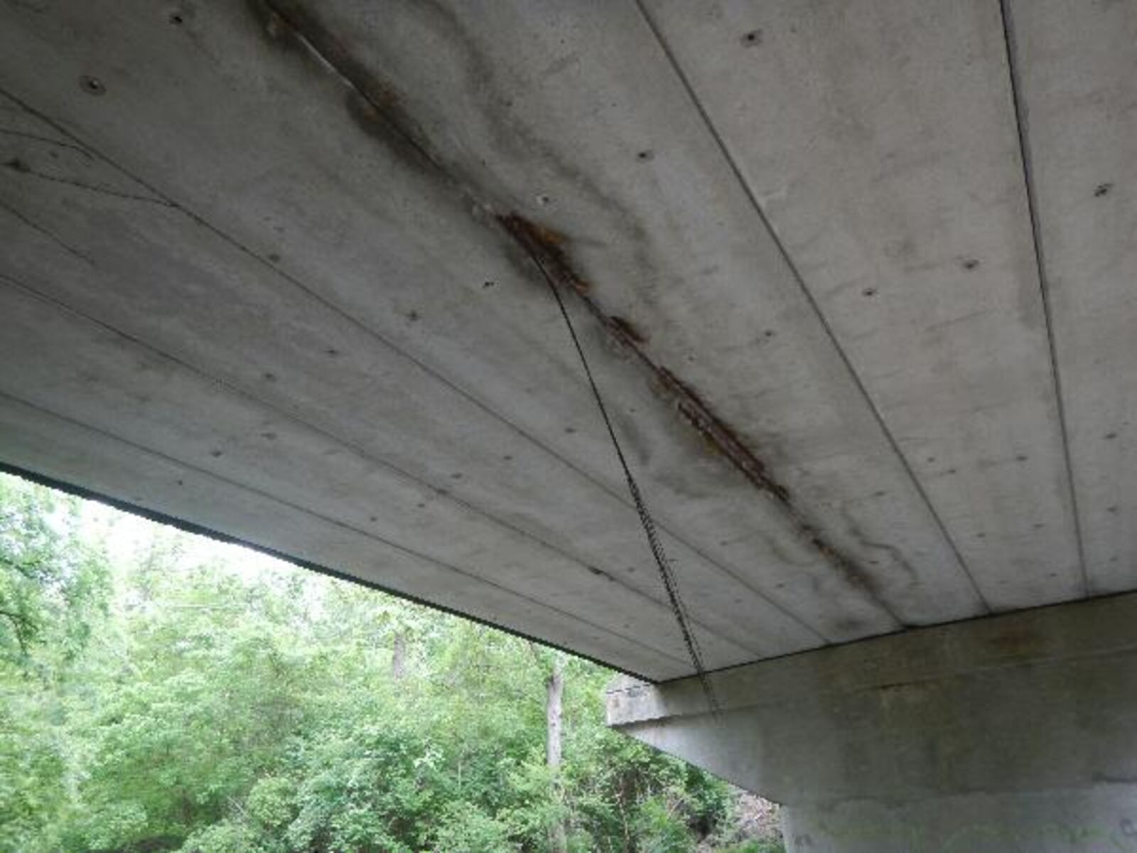 Concrete on a West Alex Bell Road bridge has deteriorated and exposed the prestressing strands at the bottom of the beams, according to Montgomery County Engineer Paul Gruner. These strands are high strength cables that can deviate quickly, he said, decreasing load carrying capacity. CONTRIBUTED