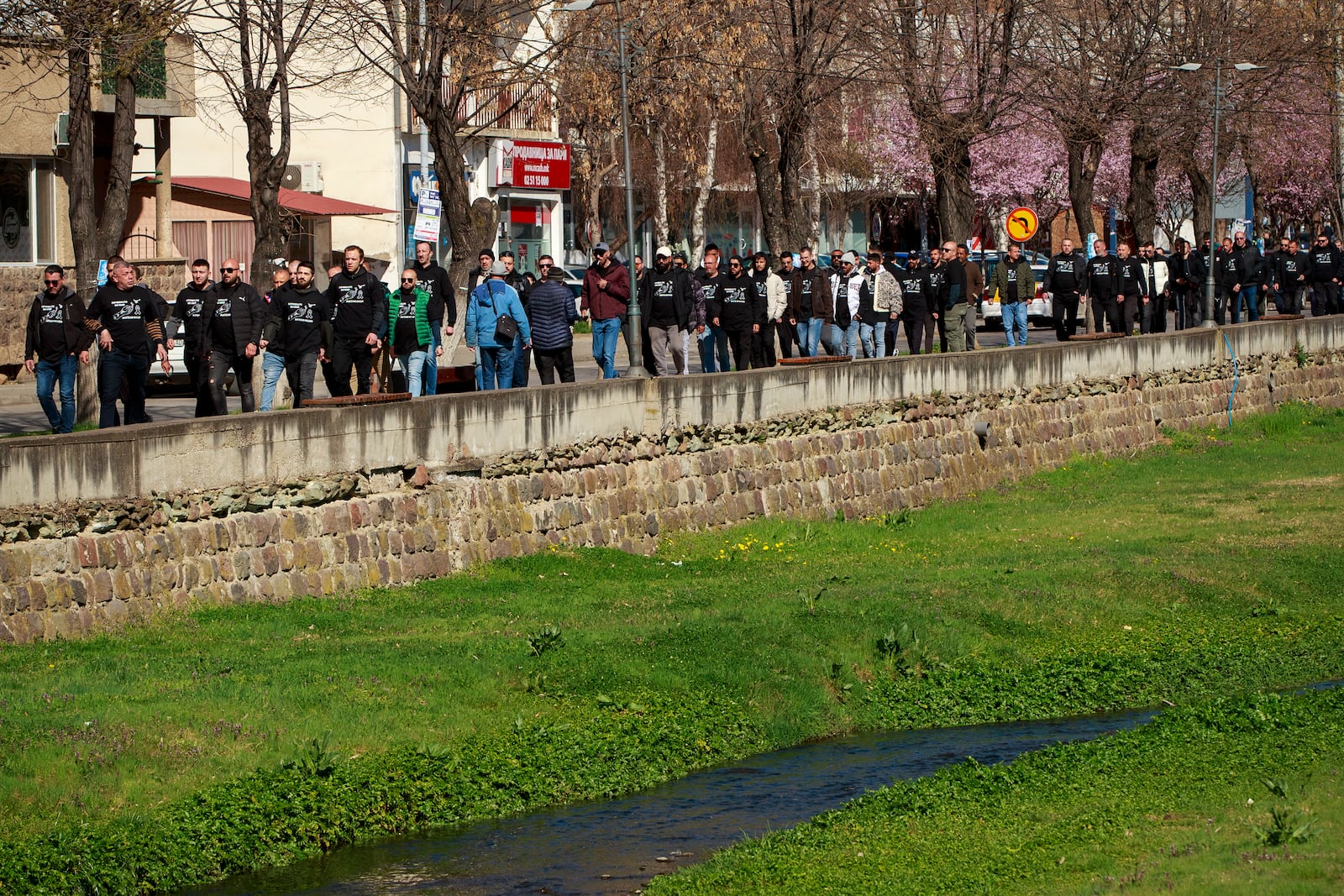 People head for the funeral ceremony of the victims of a massive nightclub fire in the town of Kocani, North Macedonia, Thursday, March 20, 2025. (AP Photo/Visar Kryeziu)