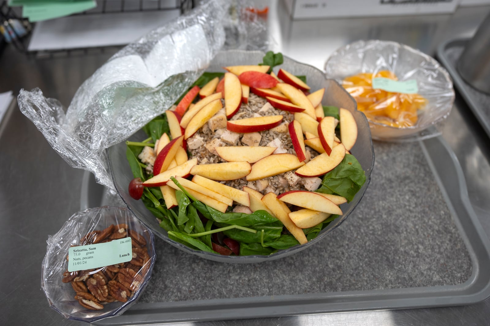 A salad prepared for college student and research subject Sam Srisatta sits on a tray in a kitchen during a study on the health effects of ultraprocessed foods at the National Institutes of Health in Bethesda, Md., on Thursday, Oct. 31, 2024. (AP Photo/Mark Schiefelbein)