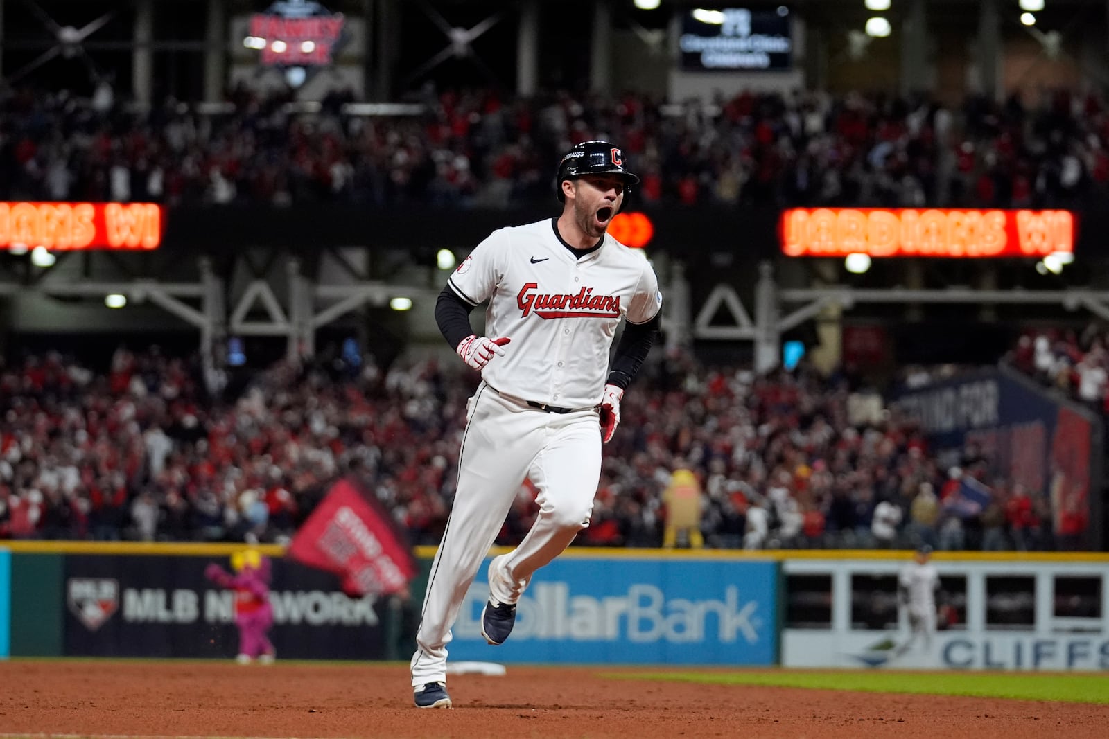 Cleveland Guardians' David Fry celebrates after hitting a game-winning two-run home run against the New York Yankees during the 10th inning in Game 3 of the baseball AL Championship Series Thursday, Oct. 17, 2024, in Cleveland. The Guardians won 7-5. (AP Photo/Jeff Roberson)