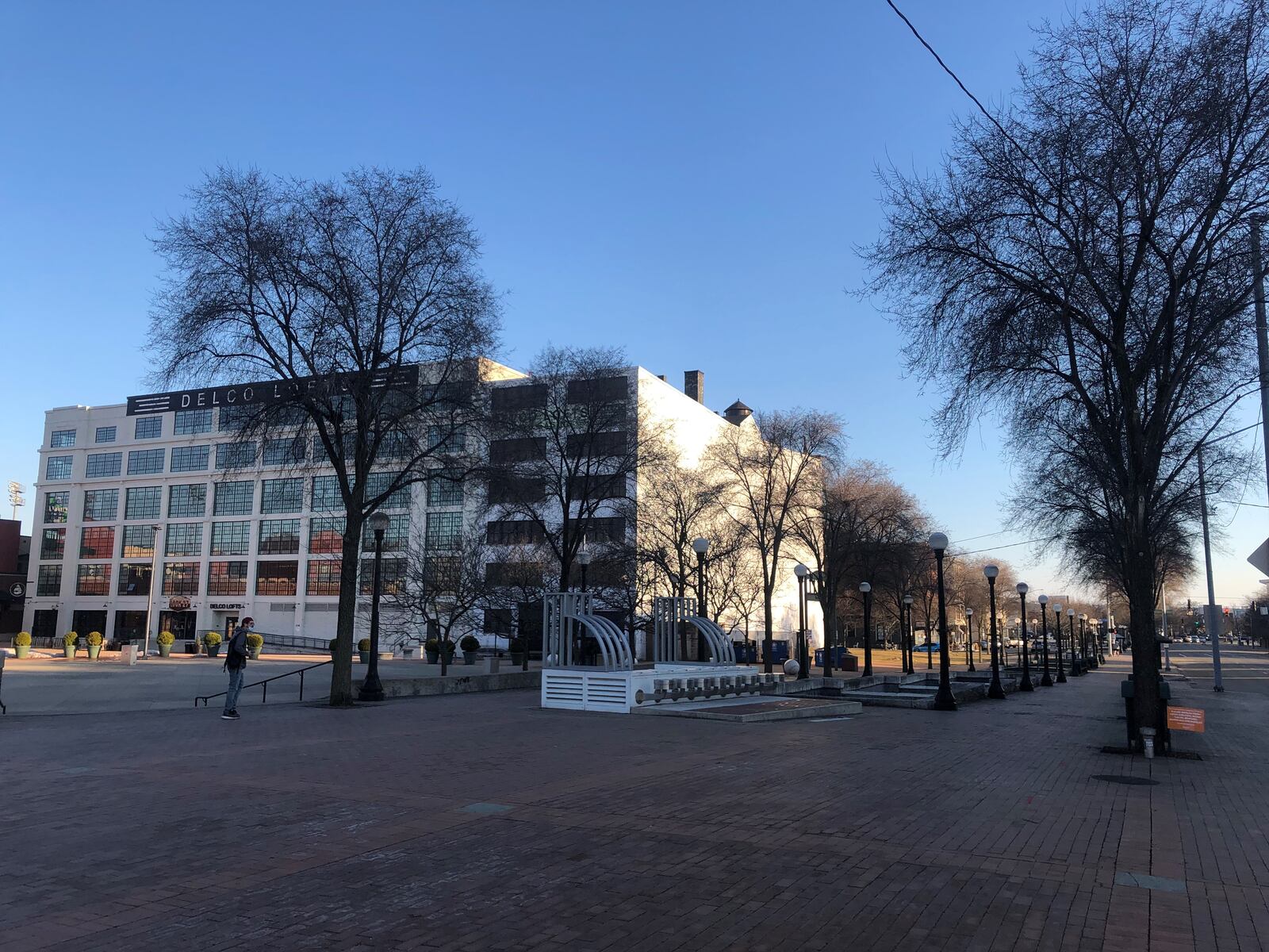 Developer Crawford Hoying plans to build new apartments, called the Sutton, on vacant land on the same block as the Delco Lofts and Lincoln Storage building on East First Street. CORNELIUS FROLIK / STAFF