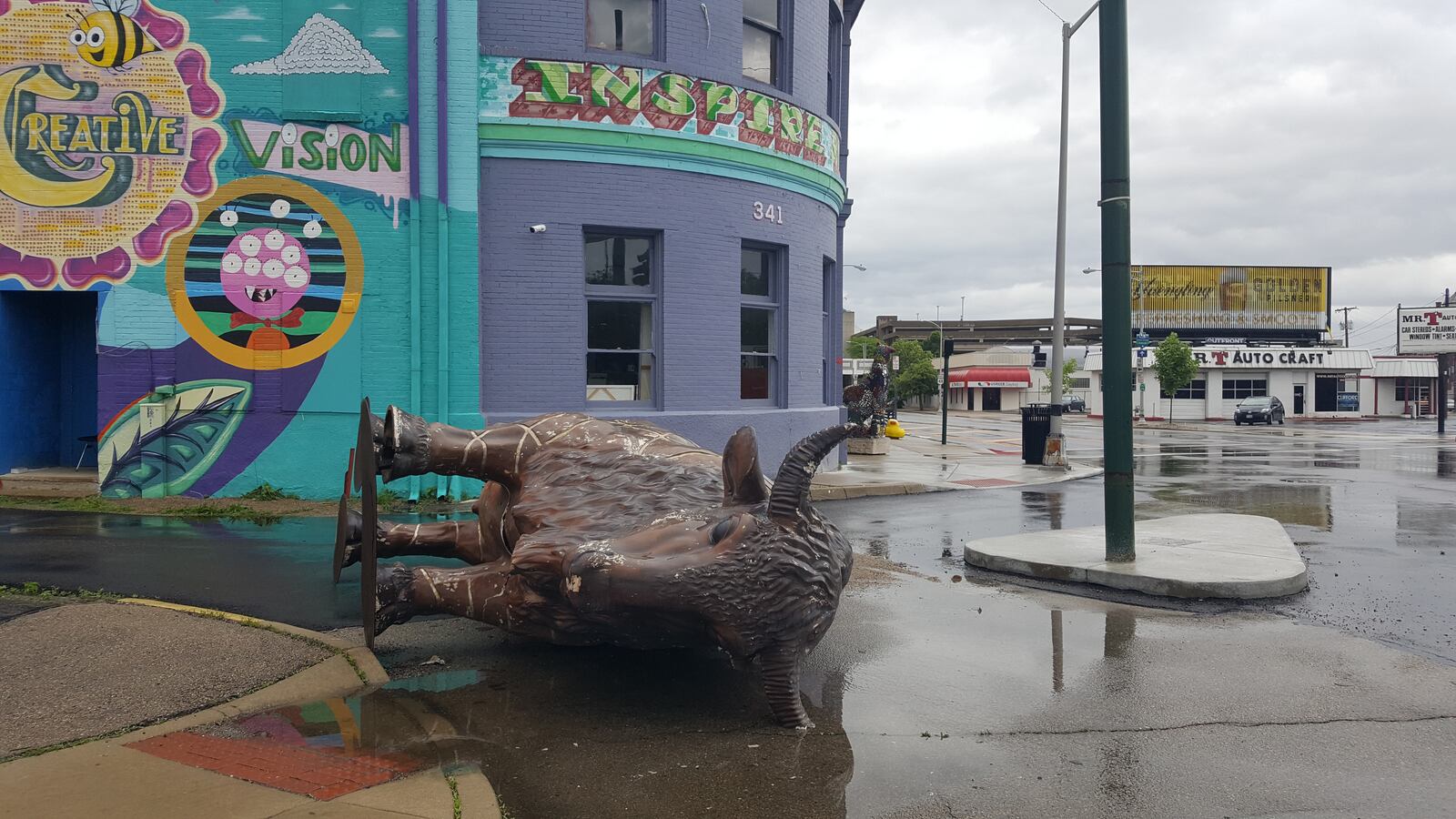 K12 Gallery and TEJAS said she is reviewing the footage from recently installed security cameras installed after vandalism issues to determine whether a large bison statue in front of their Jefferson Street gallery was blown over by the wind or knocked over. CONTRIBUTED