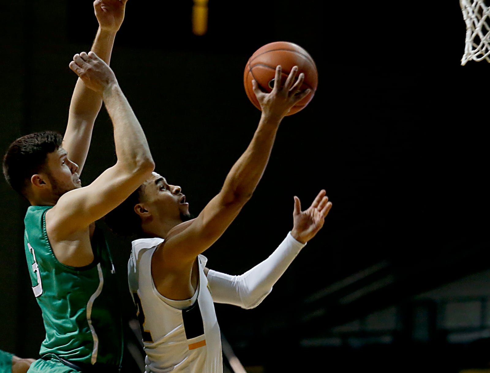 Wright State guard Tanner Holden goes to the hoop against Marshall forward Jannson Williams during a mens basketball game at the Nutter Center in Fairborn Thursday, Dec. 3, 2020. (E.L. Hubbard for the Dayton Daily News)