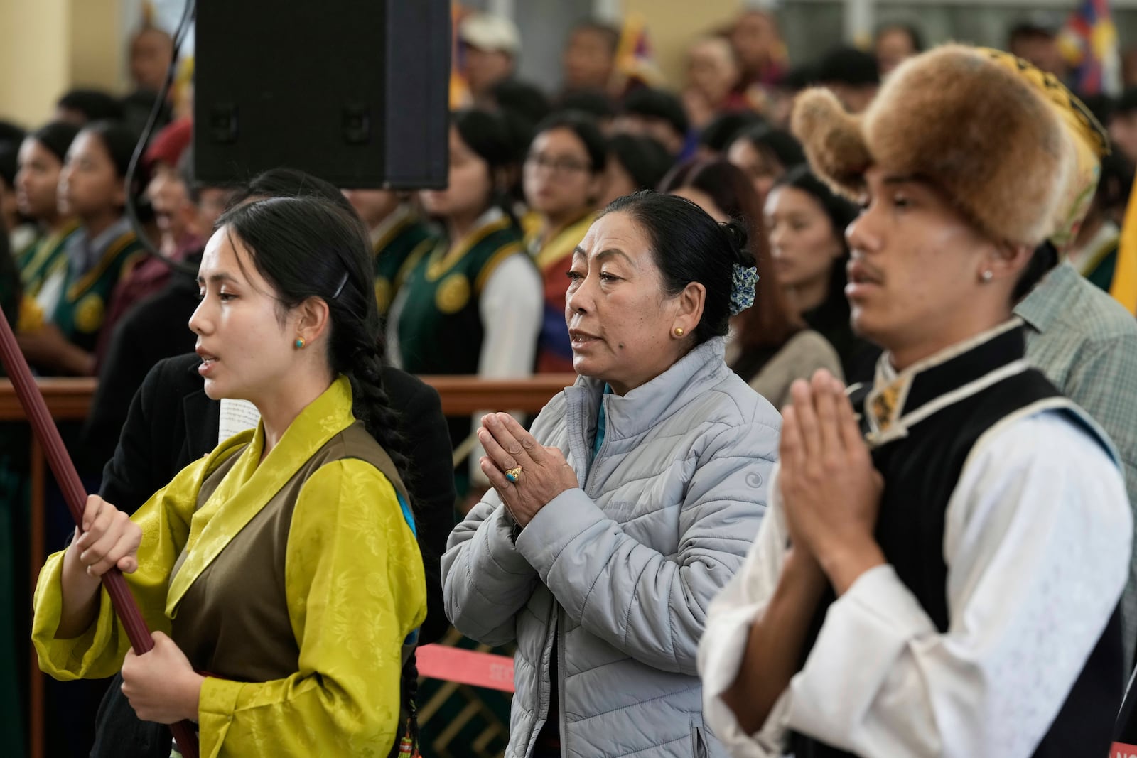 Exiled Tibetan artists pray to mark the 66th anniversary of an uprising in Tibetan capital Lhasa, as they gather at the Tsuglakhang temple in Dharamshala, India, Monday, March 10, 2025. (AP Photo/Ashwini Bhatia)