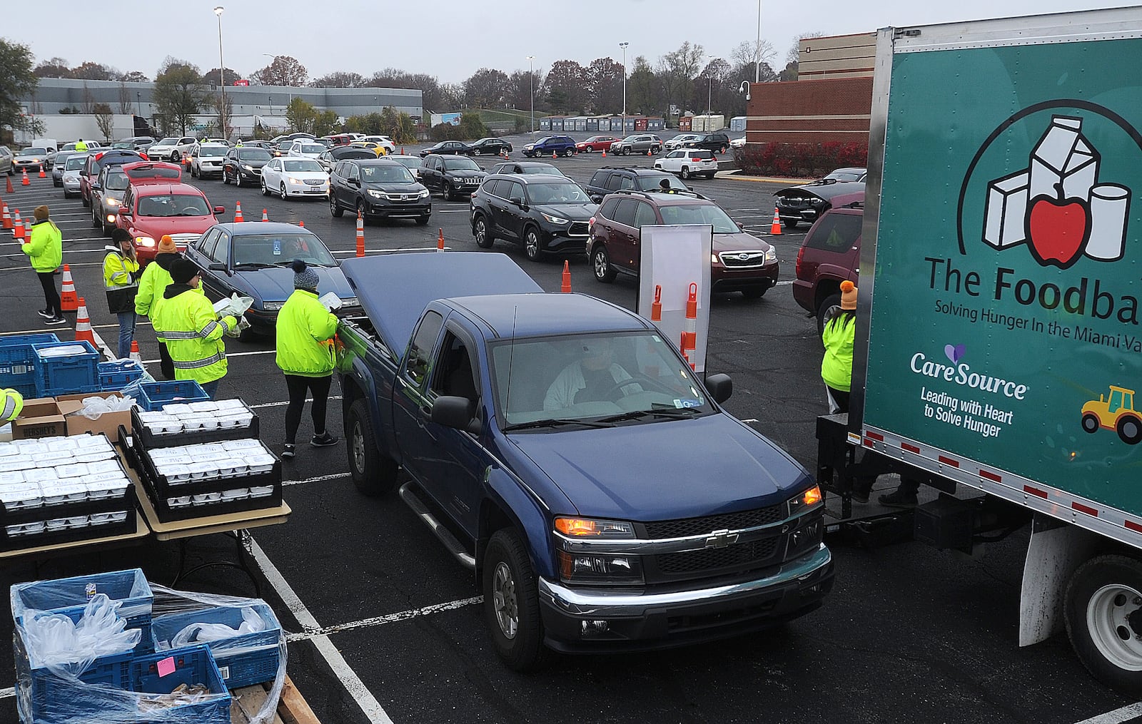 Miami Valley Meals hosted a Turkey Takeaway event at the University of Dayton Arena, Wednesday, Nov. 22, 2023 for those experiencing food insecurity. MARSHALL GORBY\STAFF