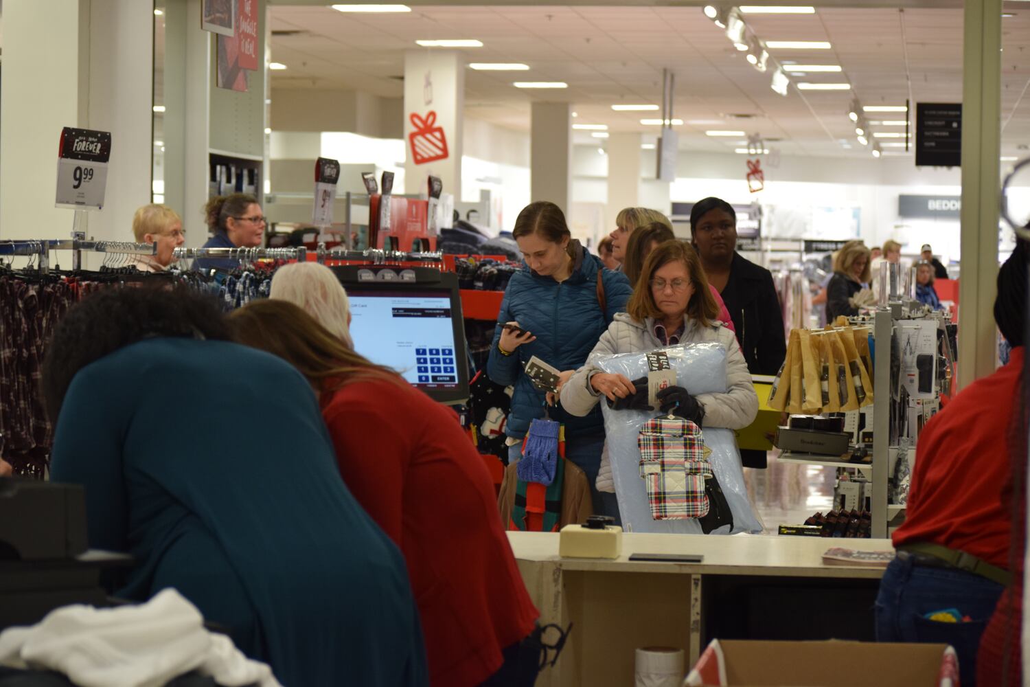 PHOTOS: Hundreds like up outside JCPenney for doorbusters, coupons