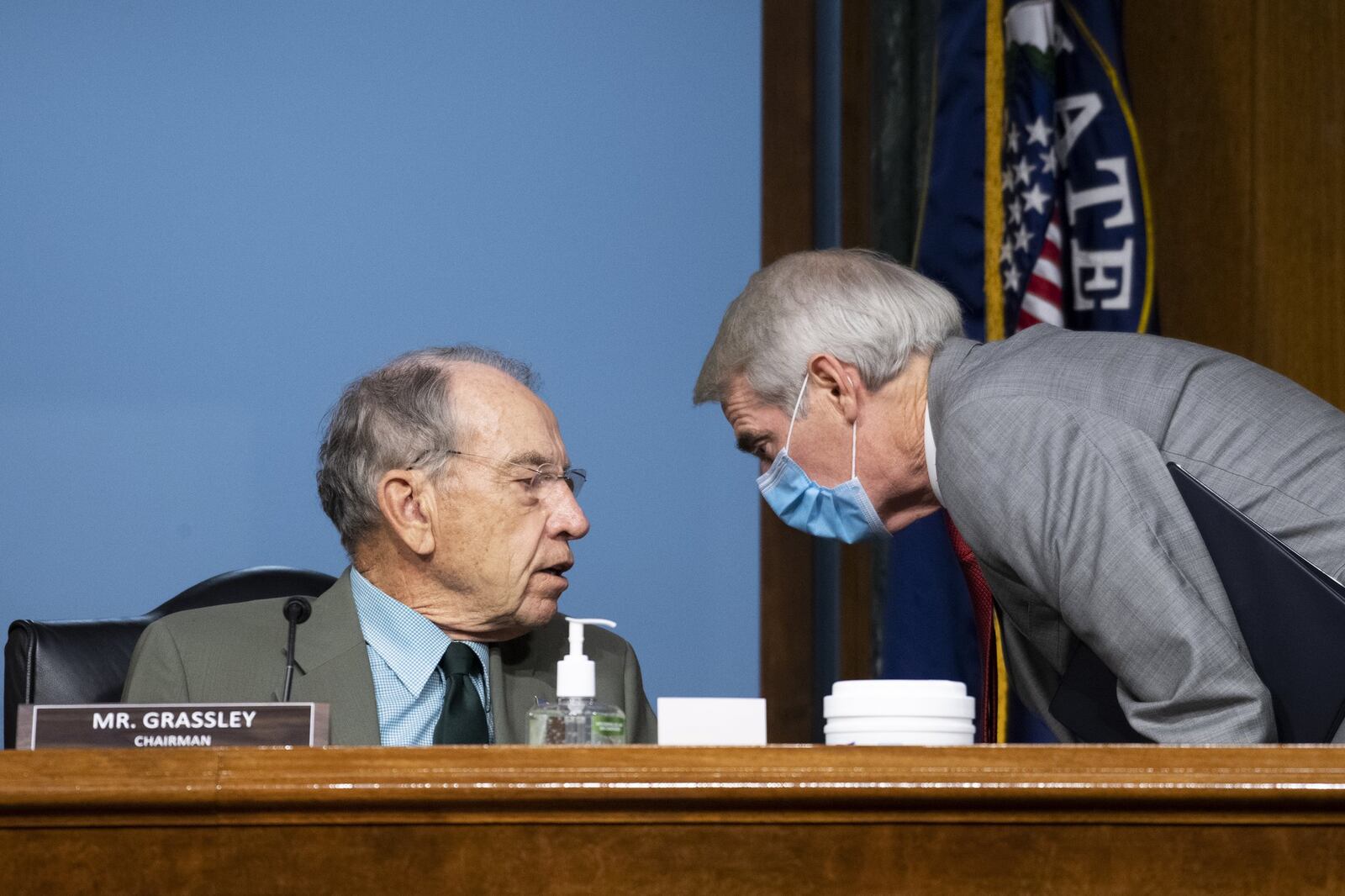 Chairman Chuck Grassley, R-Iowa, left, speaks with Sen. Rob Portman, R-Ohio during a Senate Finance Committee hearing on “COVID-19/Unemployment Insurance” on Capitol Hill in Washington on Tuesday, June 9, 2020. (Caroline Brehman/CQ Roll Call/Pool via AP)