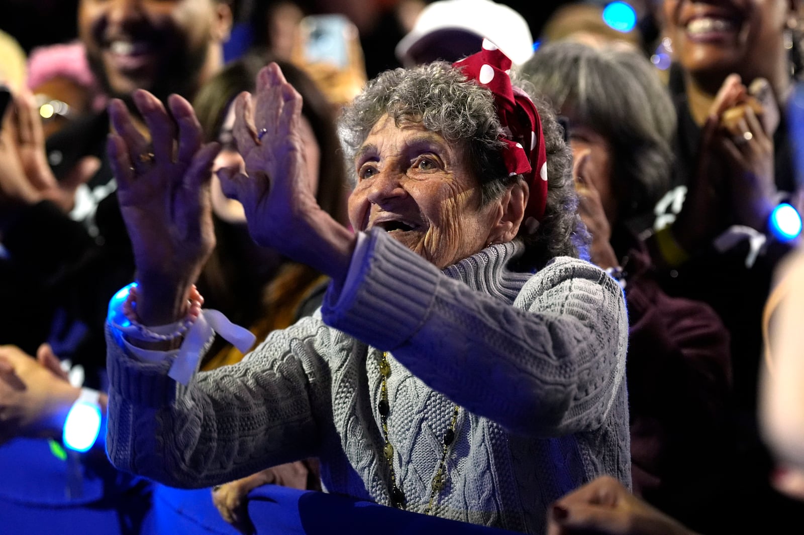 A supporter reacts as former first lady Michelle Obama speaks at a campaign rally for democratic presidential nominee Vice President Kamala Harris at the Wings Event Center, in Kalamazoo, Mich., Saturday, Oct. 26, 2024.(AP Photo/Jacquelyn Martin)