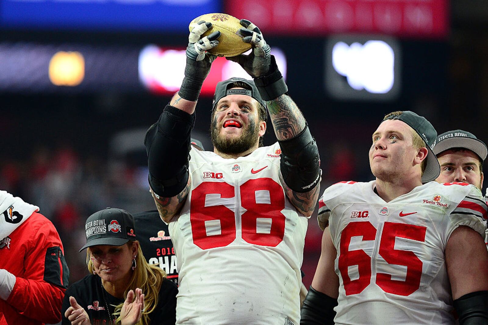 GLENDALE, AZ - JANUARY 01: Offensive lineman Taylor Decker #68 of the Ohio State Buckeyes holds the Fiesta Bowl trophy after the BattleFrog Fiesta Bowl at University of Phoenix Stadium on January 1, 2016 in Glendale, Arizona. The Ohio State Buckeyes beat the Notre Dame Fighting Irish 44-28.  (Photo by Jennifer Stewart/Getty Images)