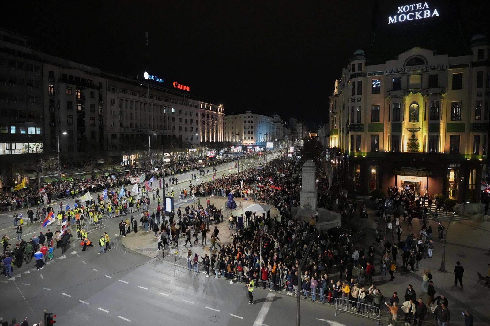 People gather to welcome students ahead of a major rally this weekend in downtown Belgrade, Serbia, Friday, March 14, 2025. (AP Photo/Darko Vojinovic)