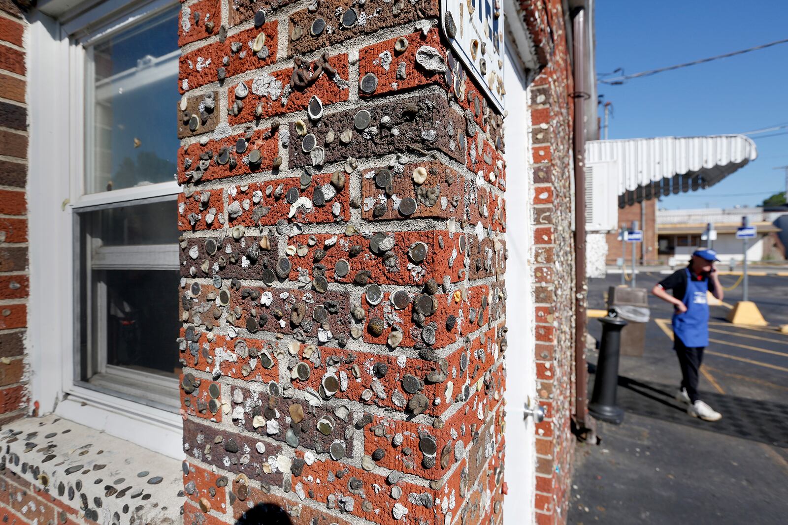 Covering the exterior of the Maid-Rite Sandwich Shop in chewing gum began in the late 1930s when customers entering the shop through the back door would stick their gum on the brick exterior rather than throwing it on the ground. LISA POWELL / STAFF