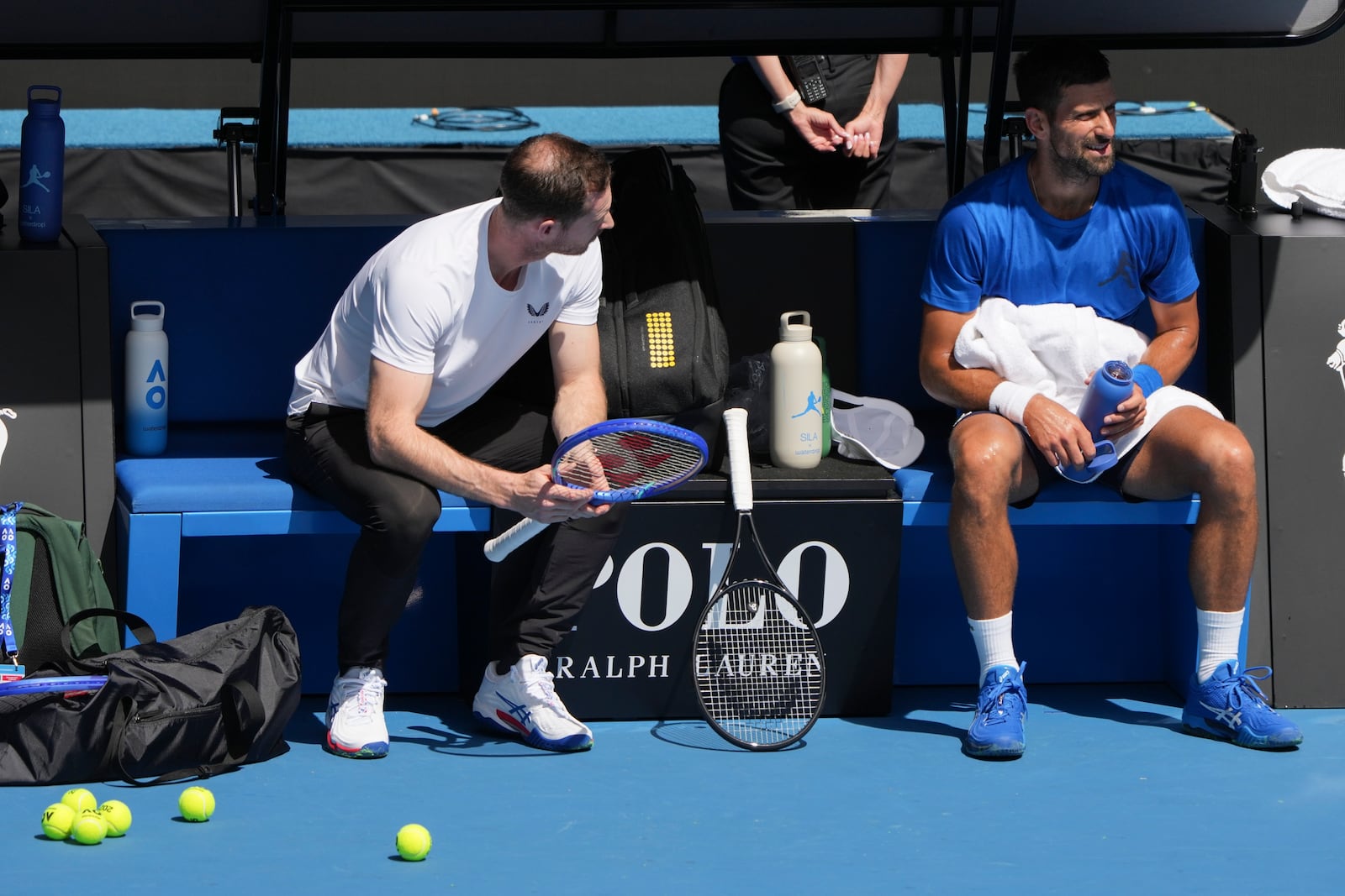 Serbia's Novak Djokovic talks with his coach Andy Murray, left, during a practice session ahead of the Australian Open tennis championship in Melbourne, Australia, Thursday, Jan. 9, 2025. (AP Photo/Mark Baker)