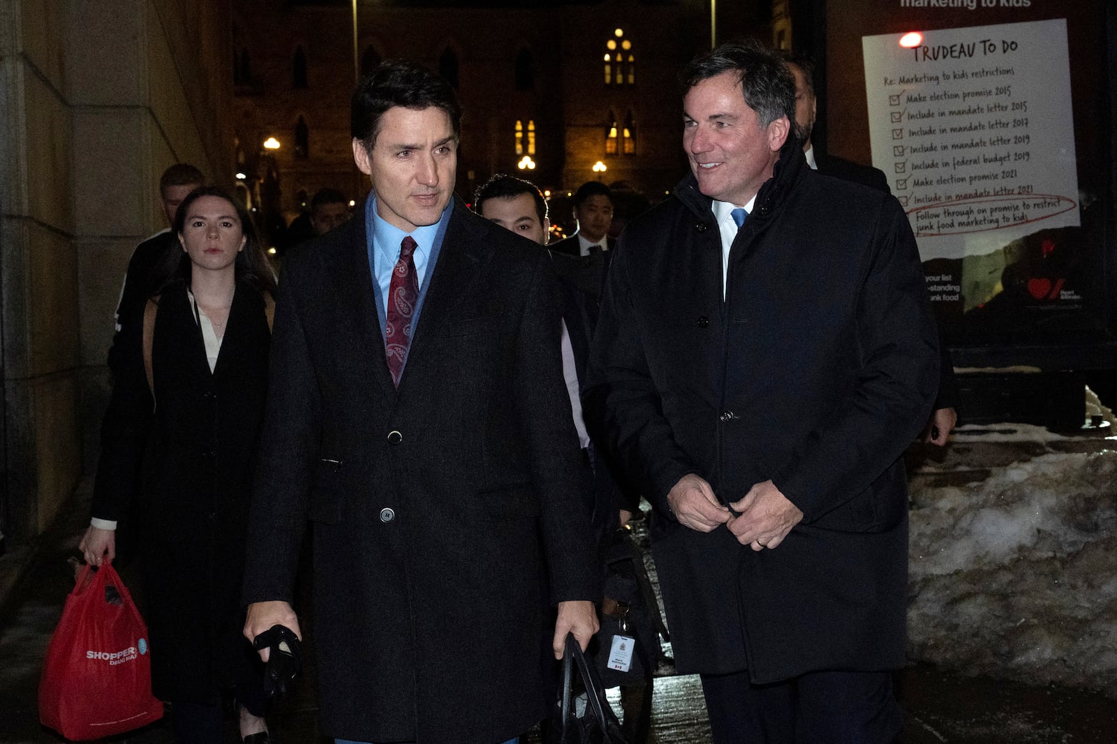 Canada's Prime Minister Justin Trudeau makes his way way his new Finance Minister, Dominic LeBlanc to a national caucus meeting, in Ottawa, Ontario, Monday, Dec. 16, 2024. (Adrian Wyld/The Canadian Press via AP)