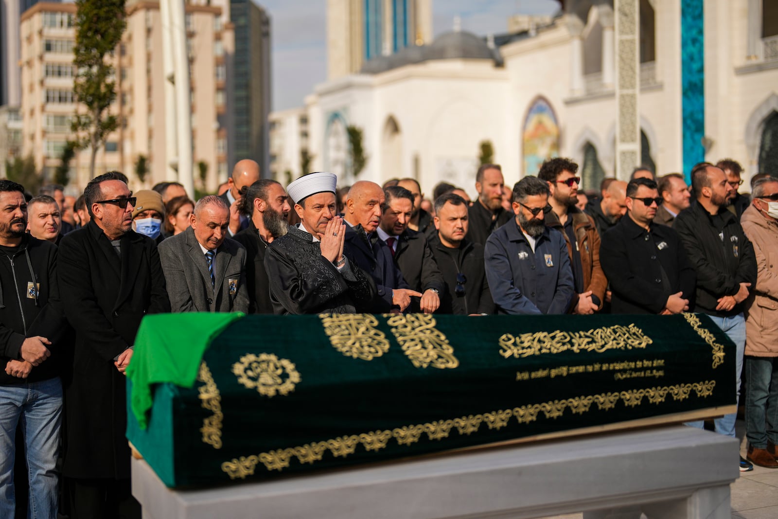 Relatives and friends mourn during the funeral of three members of the Inal family, who died in a fire that broke out at the Kartalkaya ski resort, at the Barbaros Hayreddin Pasa mosque in Istanbul, Turkey, Friday, Jan. 24, 2025. (AP Photo/Francisco Seco)