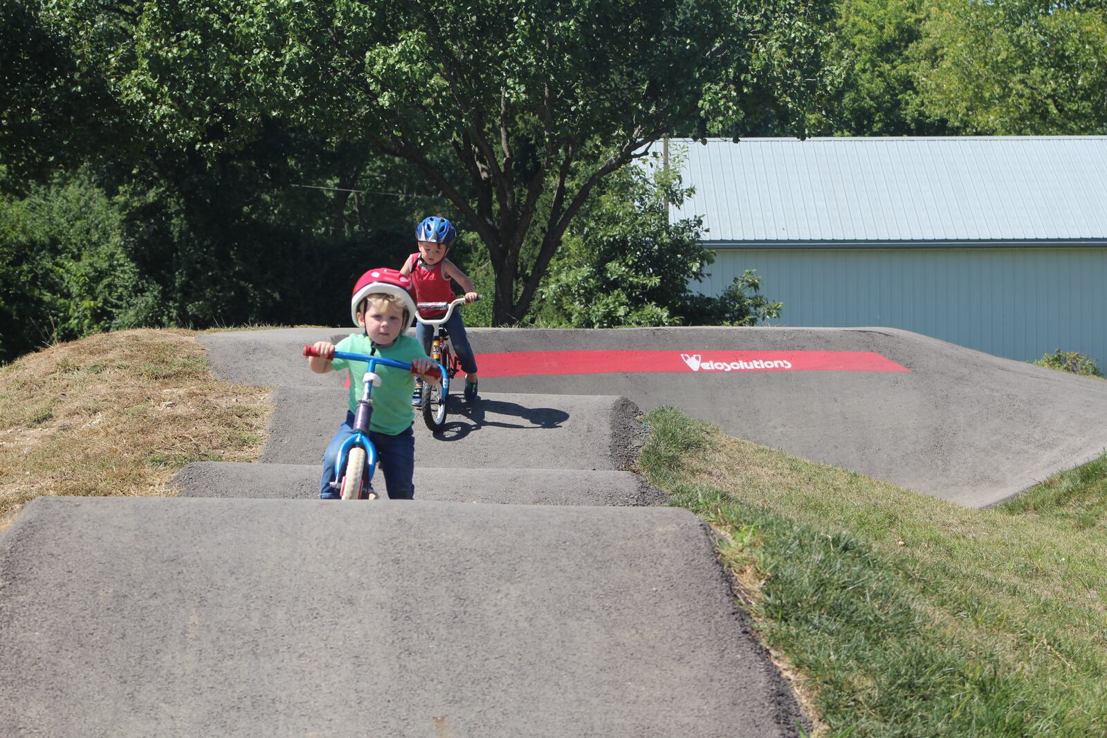 Coleson and Maclynn Porter, ages 2 and 3, play at the Monita Field Bike and Skate Park in Huber Heights on Wednesday, Aug. 31, 2022.