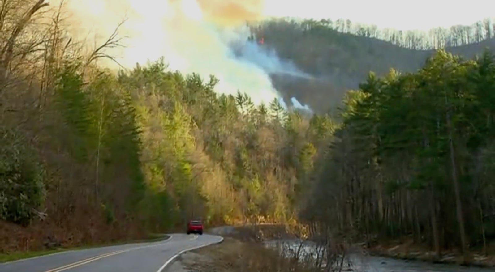 Smoke from the wildfires fill the sky in Polk County, N.C., on Saturday, March 22, 2025. (WLOS-TV via AP)